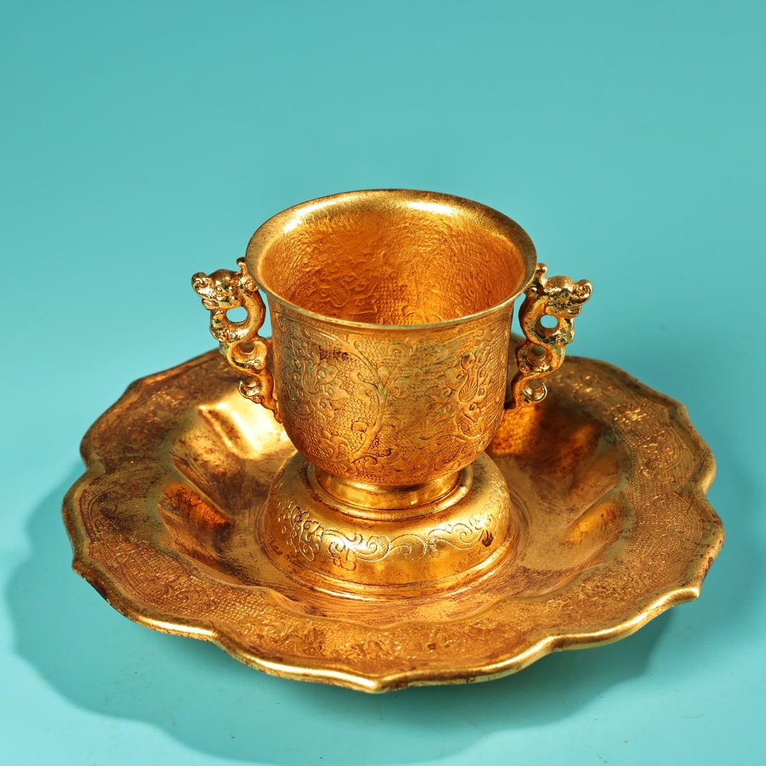 A Exquisite Gilt Bronze Dragon-Ears Cup: A Exquisite Gilt Bronze Dragon-Ears Cup,Tang Dynasty,China,Zhenguan Four-character Mark,Size:6.3in,2.2inx2.6in,Weight:340g 铜鎏金龙耳杯,中国唐