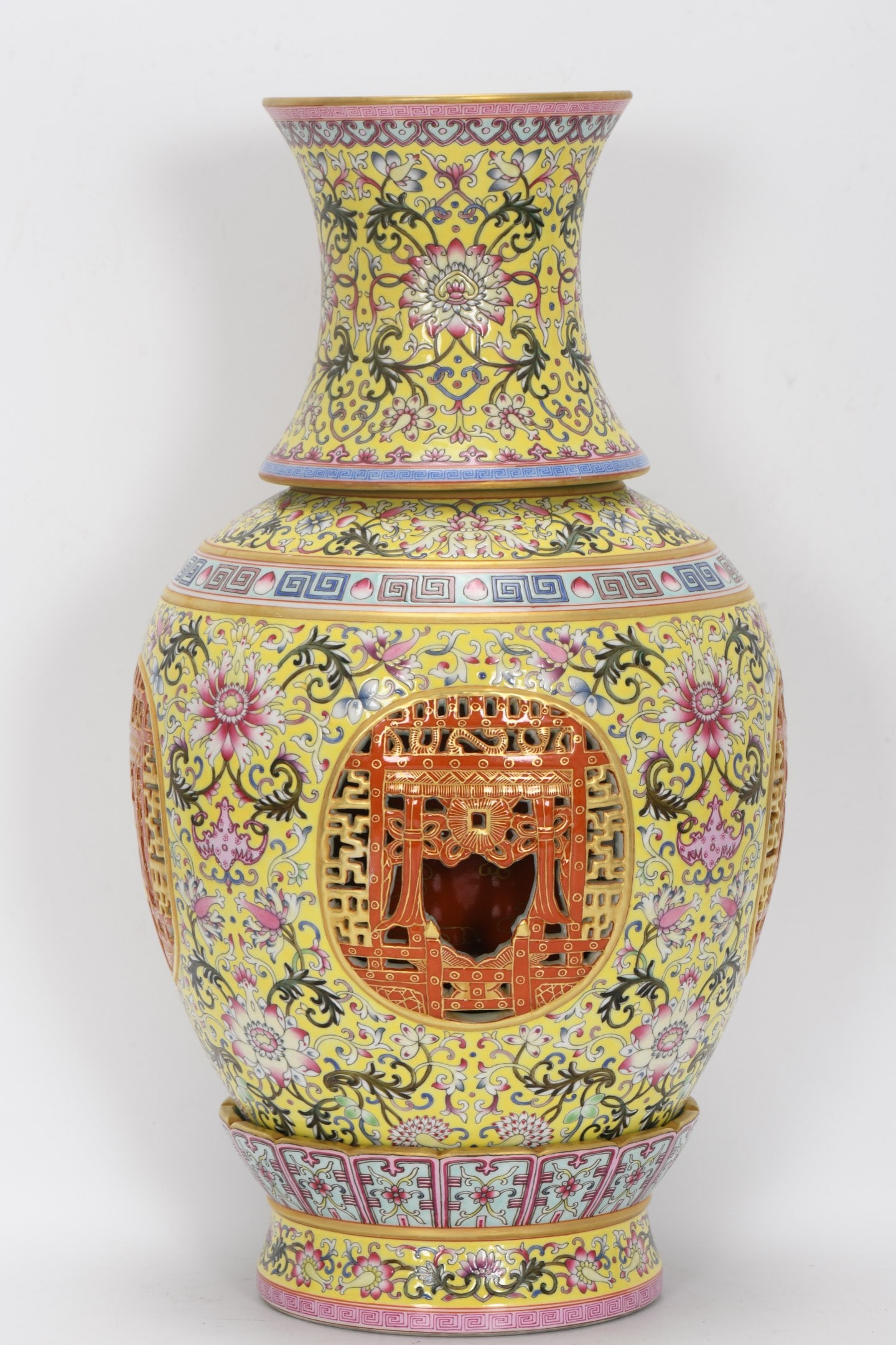 A Exquisite Famille-Rose Yellow Ground Hollow Painted Gold Flower pattern Vase: A Exquisite Famille-Rose Yellow Ground Hollow Painted Gold Flower pattern Vase,Qing Dynasty, China,Qianlong Four-character Mark,Size:16.3inx4.9inx9.1inx5.6in 