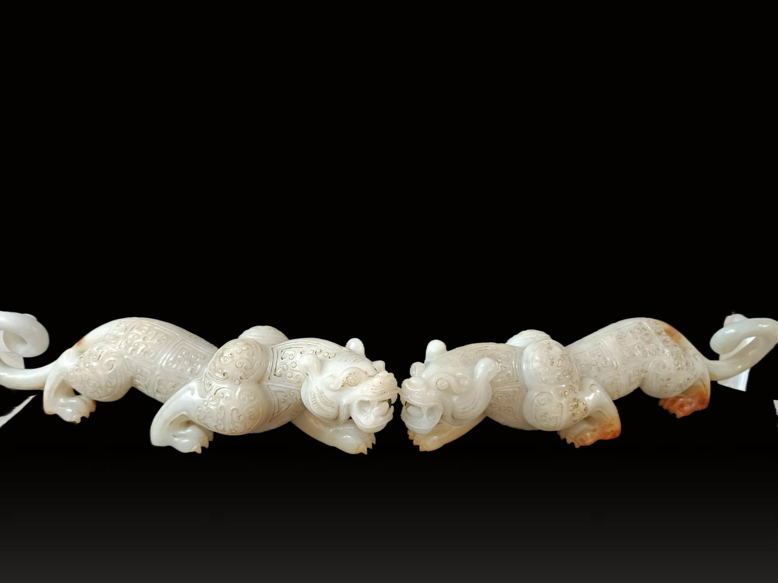 A pair of Exquisite Hotan Jade Tigers: A pair of Exquisite Hotan Jade Tigers,Qing Dynasty, China,Size:3.1inx14.2in,Weight:1829g 一对和田玉虎,中国清代