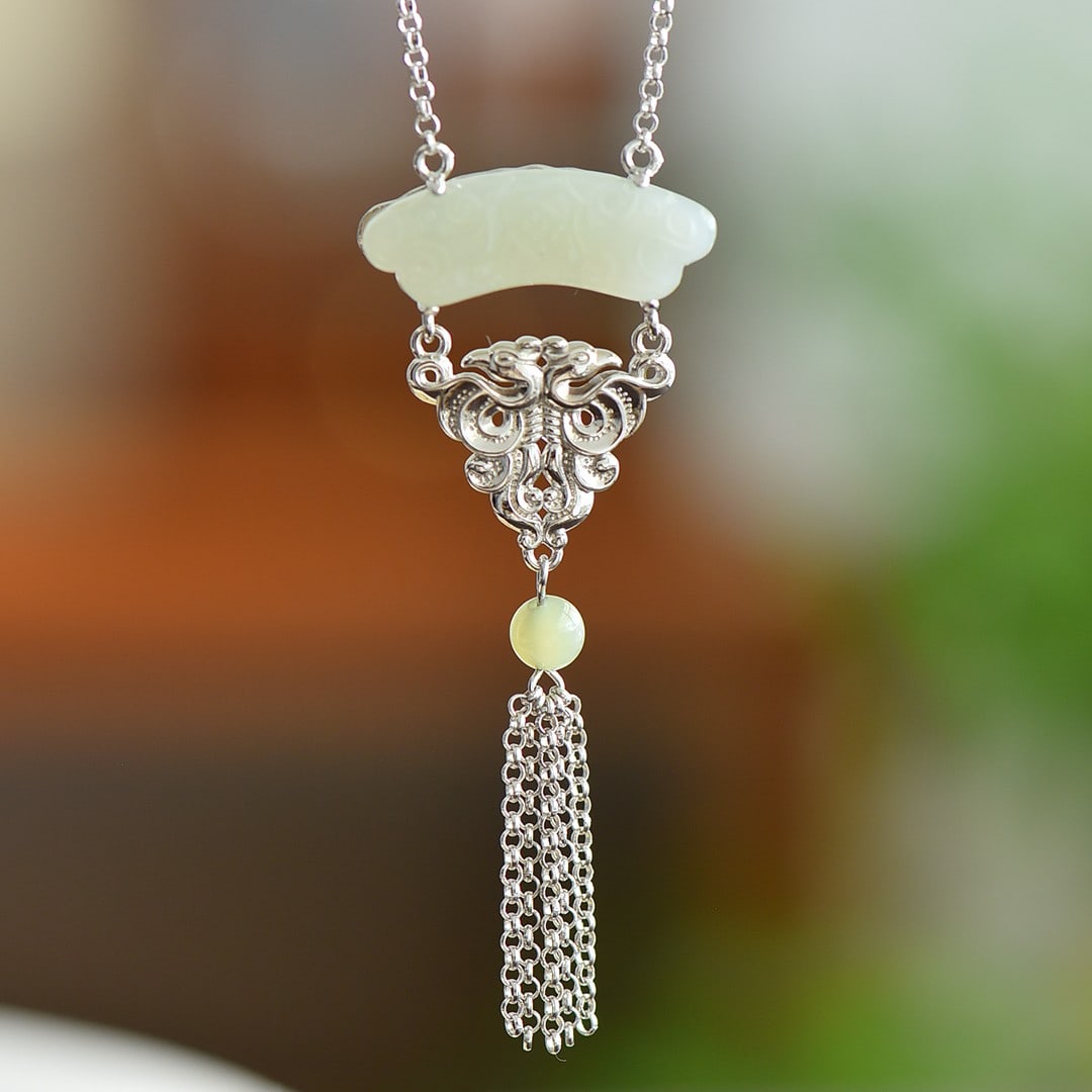 An Exquisite Sterling Silver Inlaid White Jade Pendant: An Exquisite Sterling Silver Inlaid White Jade Pendant,Size:10mmx28mm 纯银镶白玉吊坠