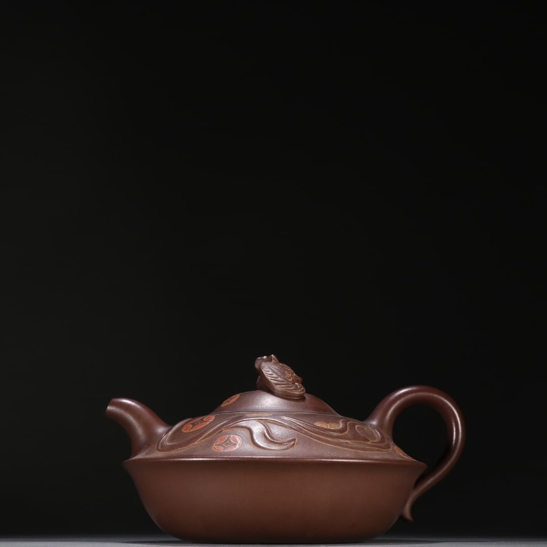 An Exquisite Purple Sands Teapot: An Exquisite Purple Sands Teapot Qing Dynasty, China Size:4.7inx8in紫砂福在眼前茶壶 中国清代 Size:12cmx20.3cm