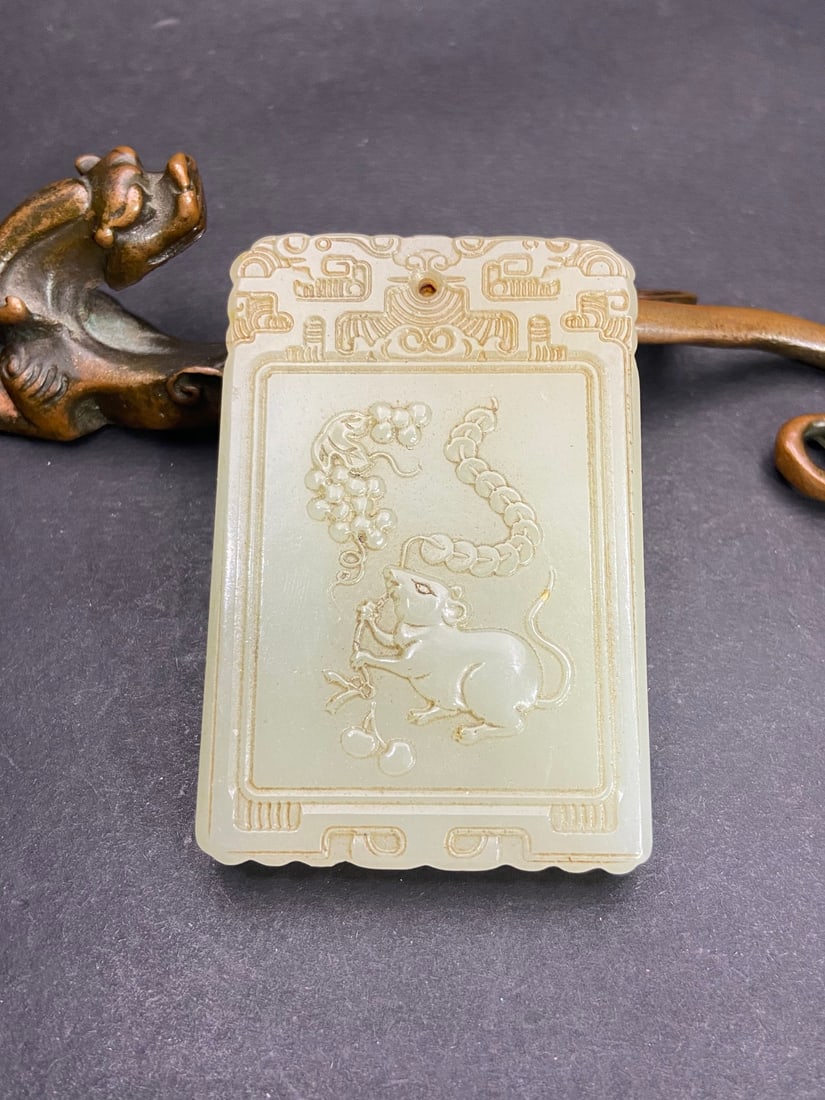 An Exquisite White Jade Squirrel and Grapes Pattern Brand: An Exquisite White Jade Squirrel and Grapes Pattern Brand Qing Dynasty, China Size:2.7inx1.8inx0.4in