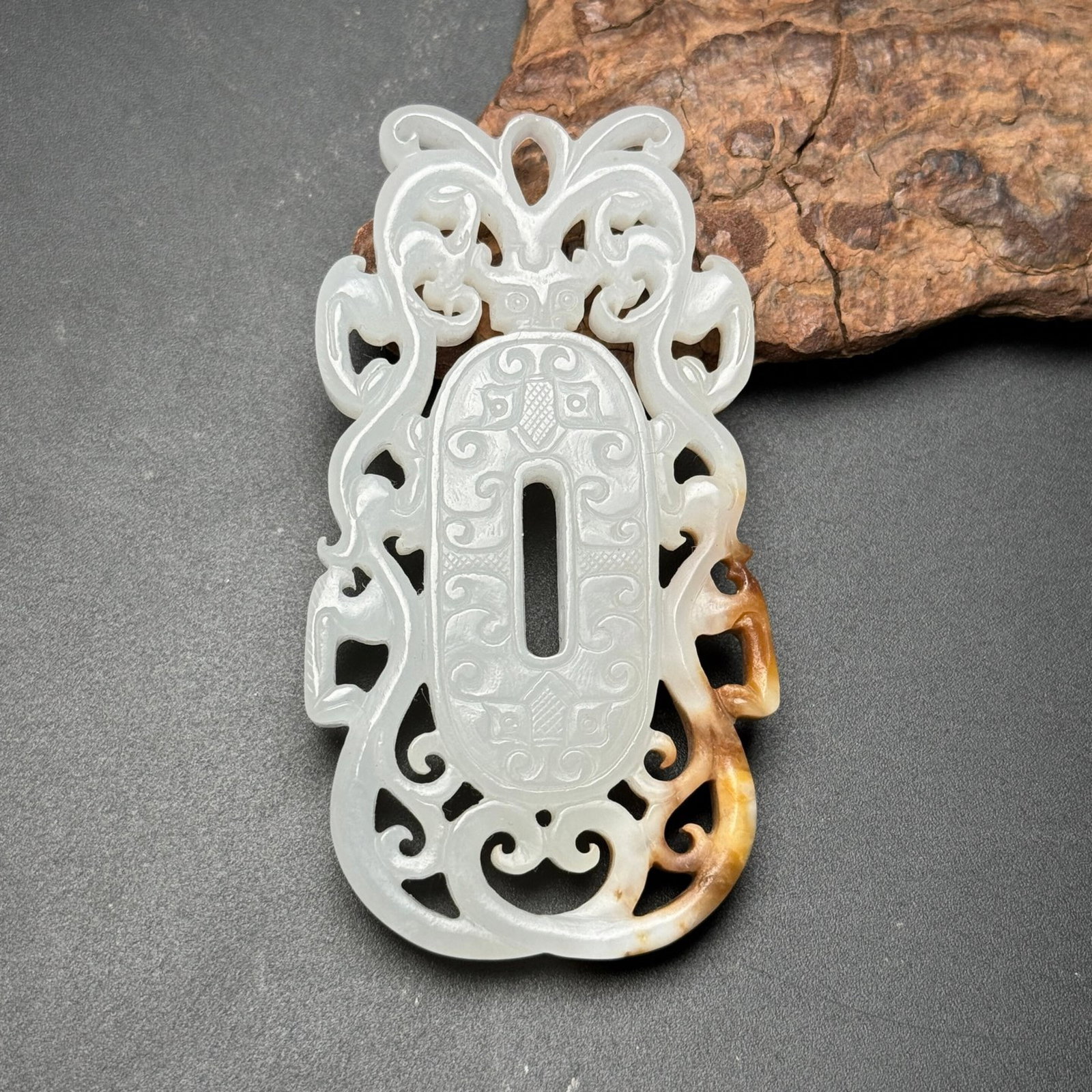 An Exquisite White Jade Beast-Face Pattern Pendant: An Exquisite White Jade Beast-Face Pattern Pendant,Qing Dynasty,China,Size:79mmx42mmx7mm,Weight:43g 白玉兽面纹挂件,中国清代