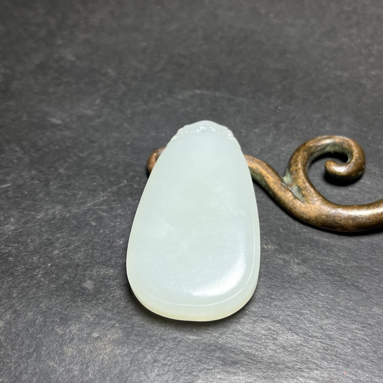An Exquisite White Jade Pendant: An Exquisite White Jade Pendant,Qing Dynasty,China,Size:45mmx7mmx26mm,Weight:18g 白玉挂件,中国清代