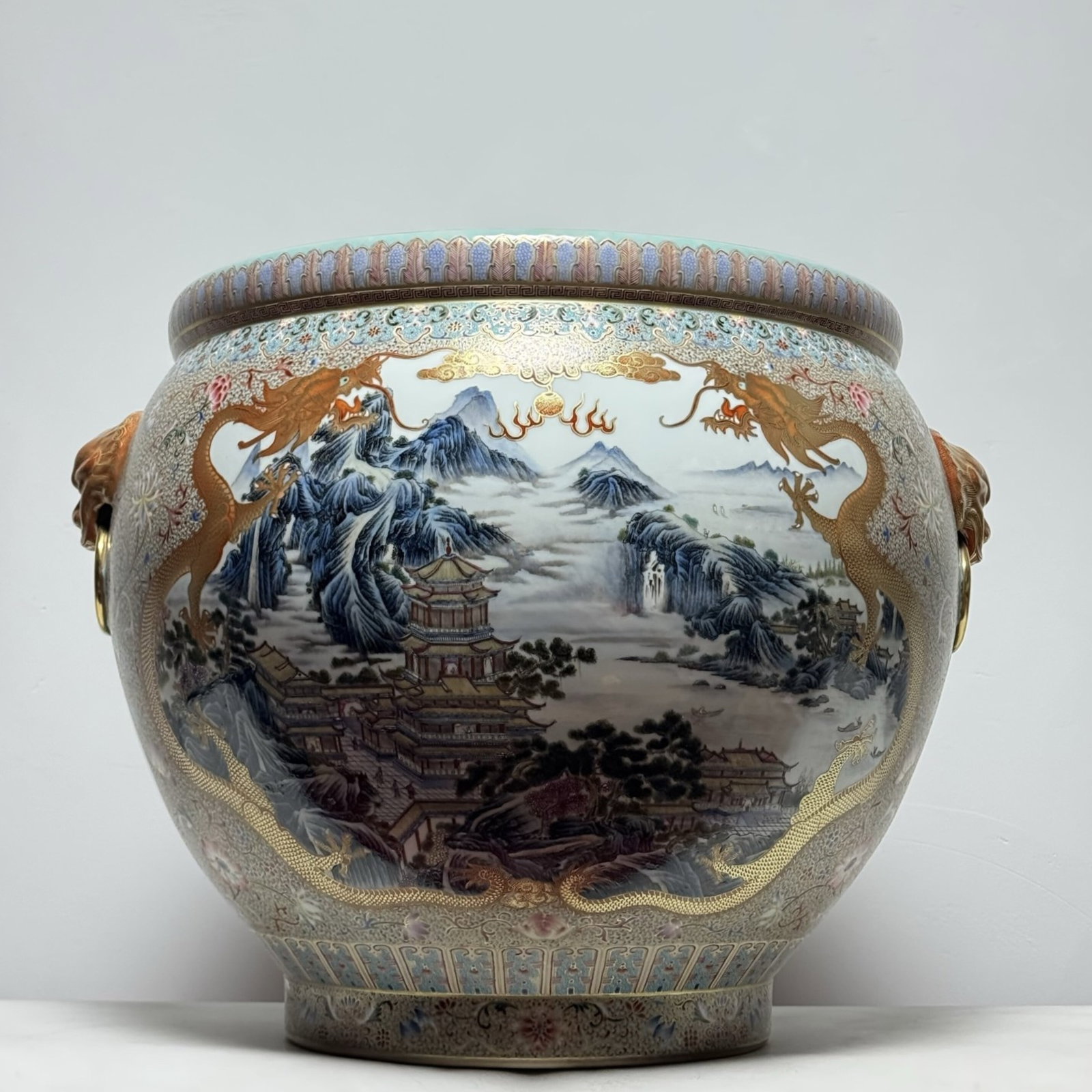 A Huge Famille-Rose Turquoise Ground Painted Gold Landscape?Figure and Dragon Pattern Lion-Ears: A Huge Famille-Rose Turquoise Ground Painted Gold Landscape,Figure and Dragon Pattern Lion-Ears Vat,With Poem,Qing Dynasty,China,Qianlong Four-character Mark,Size:25.6inx18.8in 粉彩松