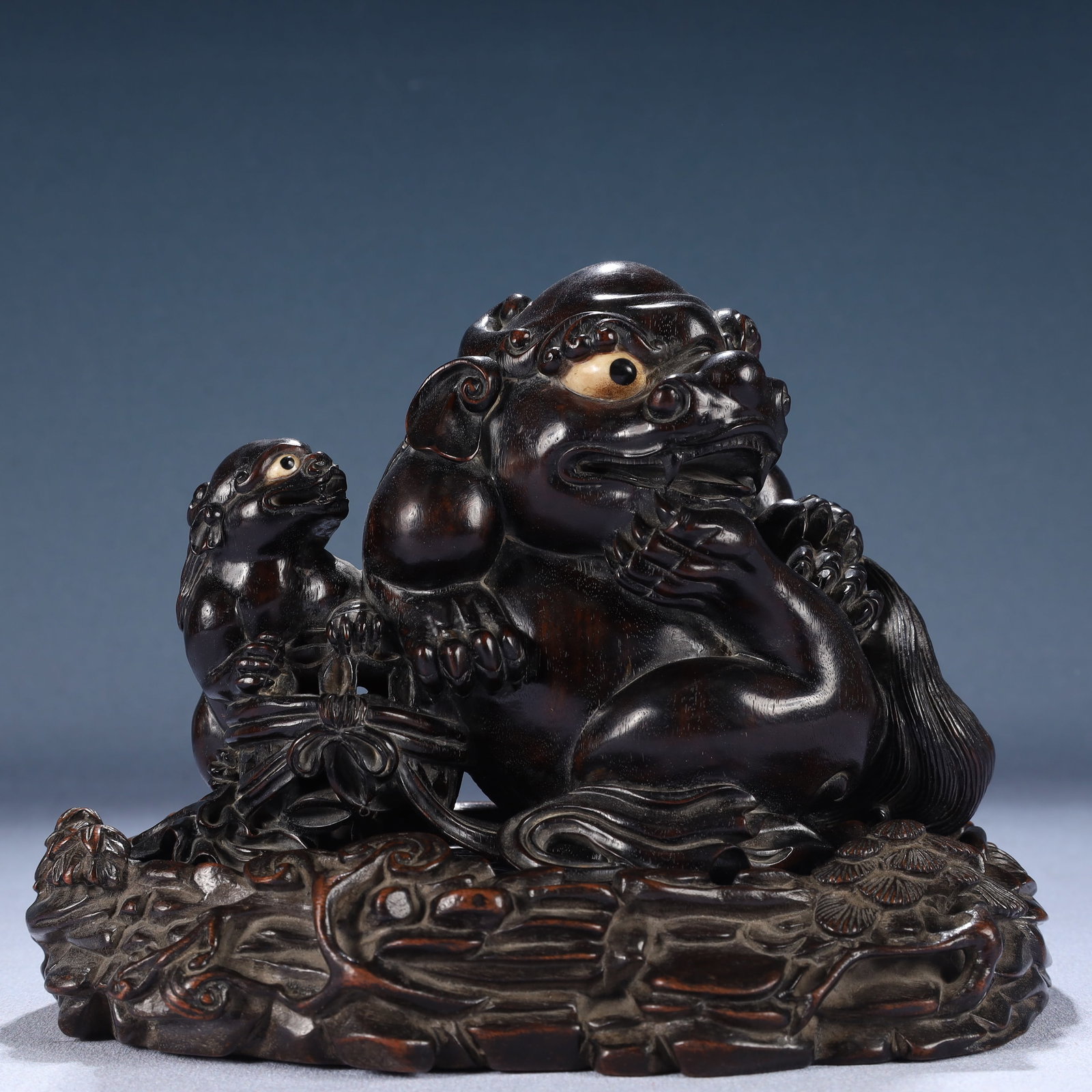 An Exquisite Zitanwood Auspicious Beast Ornament,With Base: An Exquisite Zitanwood Auspicious Beast Ornament,With Base,Qing Dynasty, China,Size:7.5inx4.7inx5.9in,Weight:1100g 紫檀木瑞兽摆件,带底座,