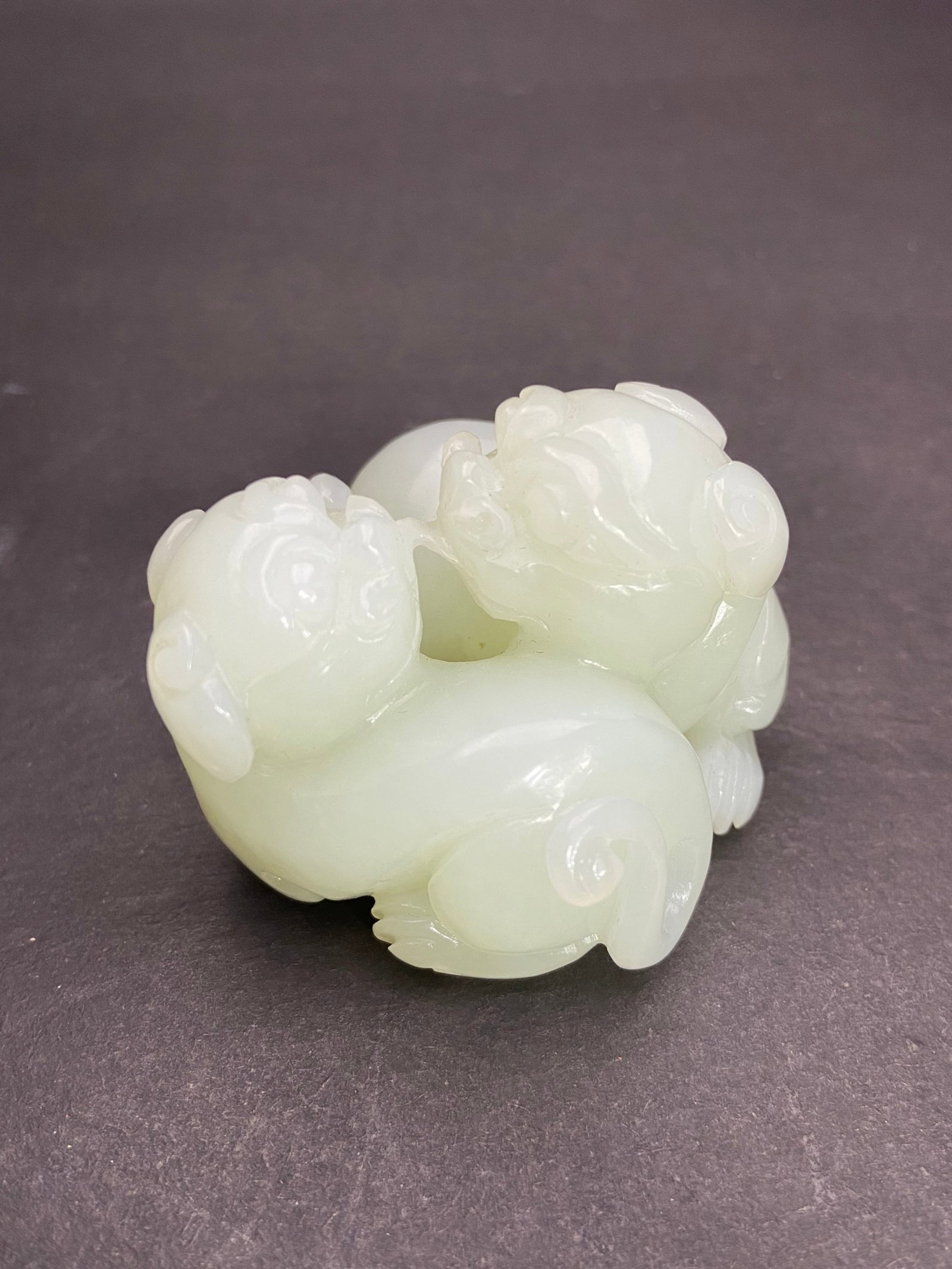 An Exquisite White Jade Lion Hand Piece: An Exquisite White Jade Lion Hand Piece,Qing Dynasty,China,Size:48mmx51.7mmx41.5mm,Weight:145g 白玉狮子手把件,中国清代