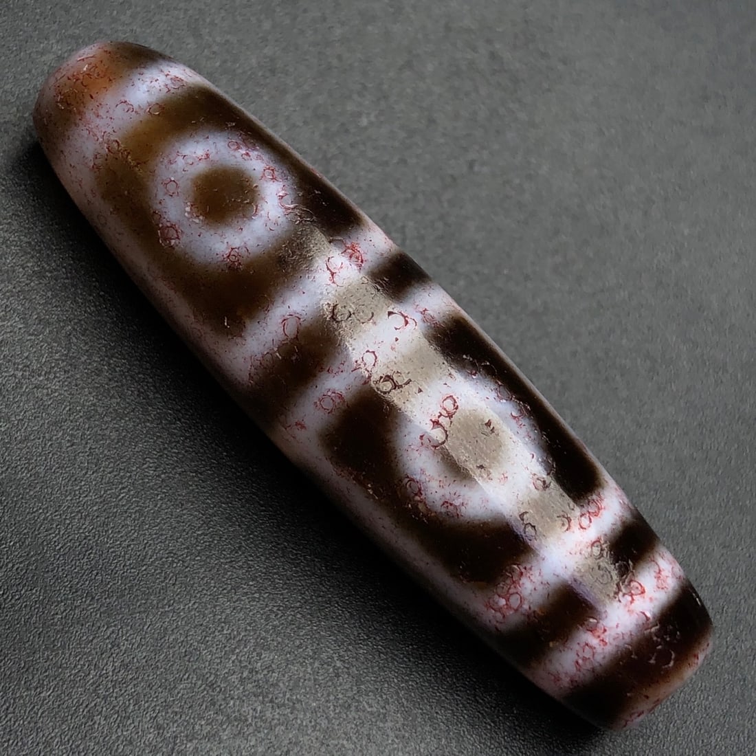An Exquisite Four Eyes Dzi Bead Pendant: An Exquisite Four Eyes Dzi Bead Pendant,Size:49mmx13mm,Weight:13g 四眼天珠挂件