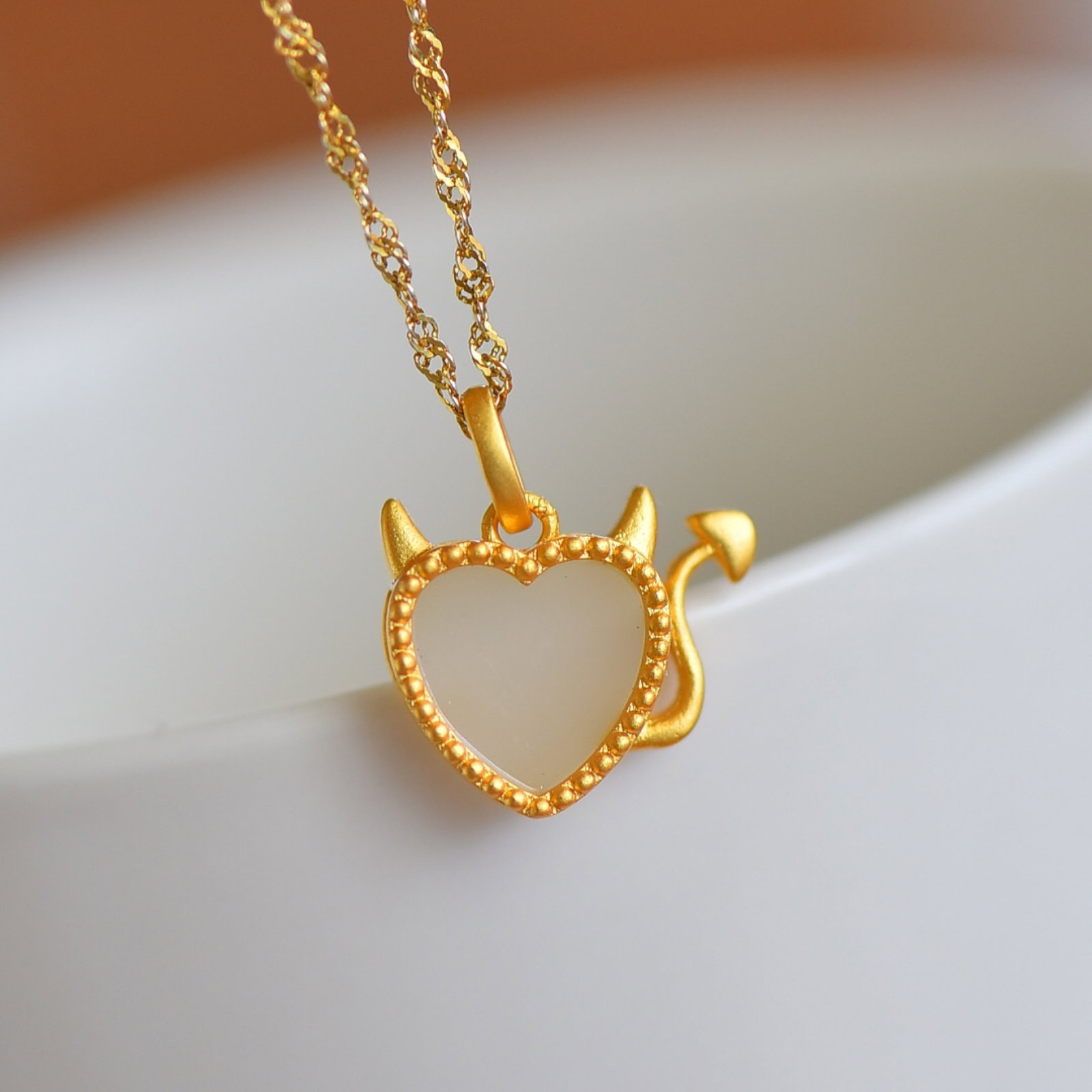 An Exquisite Sterling Silver-Gold Plated Inlaid White Jade Pendant: Sterling Silver-Gold Plated Inlaid White Jade Pendant , Size :10mmx10mm 纯银镀金镶白玉吊坠,尺寸:10mmx10mm