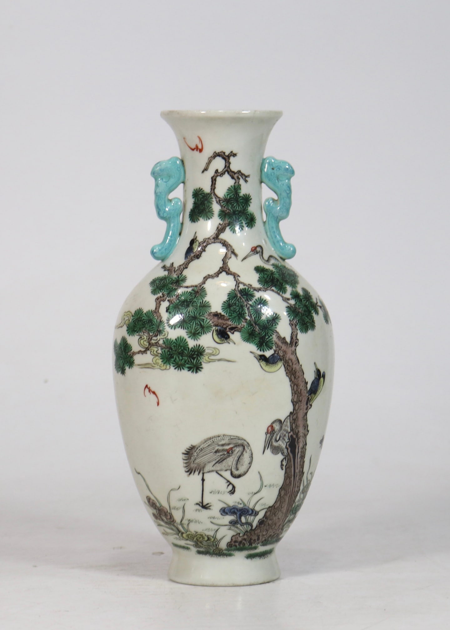An Exquisite Wucai Pine and Crane Pattern Double-Ears Vase: An Exquisite Wucai Pine and Crane Pattern Double-Ears Vase Qing Dynasty, China Qianlong Four-character Mark Size:8.9inx4.1in五彩松鹤延年壁挂瓶 