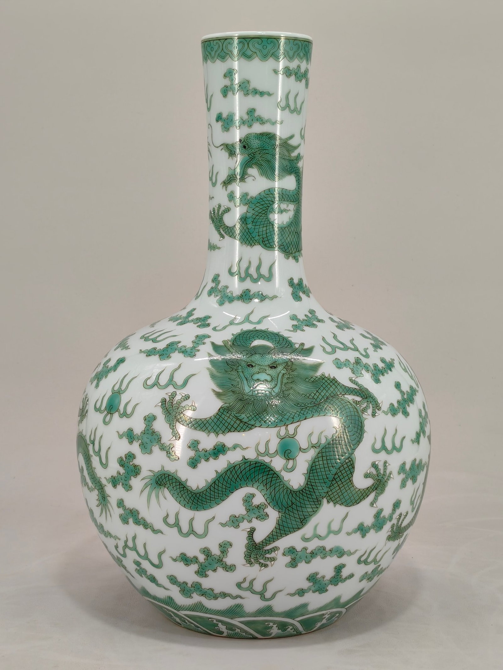 A Rare Green Color Auspicious Cloud and Dragon Pattern Vase: A Rare Green Color Auspicious Cloud and Dragon Pattern Vase,Qing Dynasty,China,Qianlong Six-character Mark,Size:15inx9.4in 绿彩祥云龙纹瓶,中国