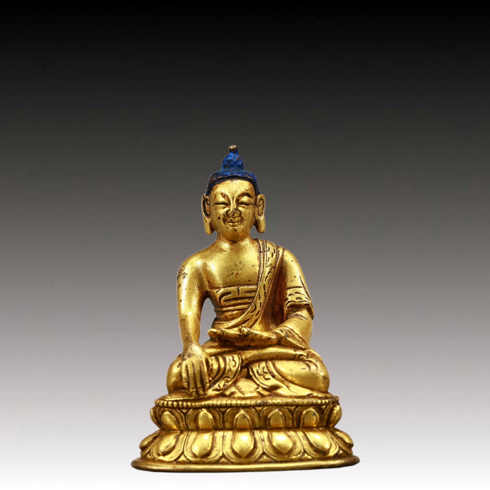 A Solemn Gilt Bronze Statue of Sakyamuni: A Solemn Gilt Bronze Statue of Sakyamuni,Qing Dynasty, China,Size:1.8inx1.4inx2.8in,Weight:150g 铜鎏金释迦摩尼像,中国清代
