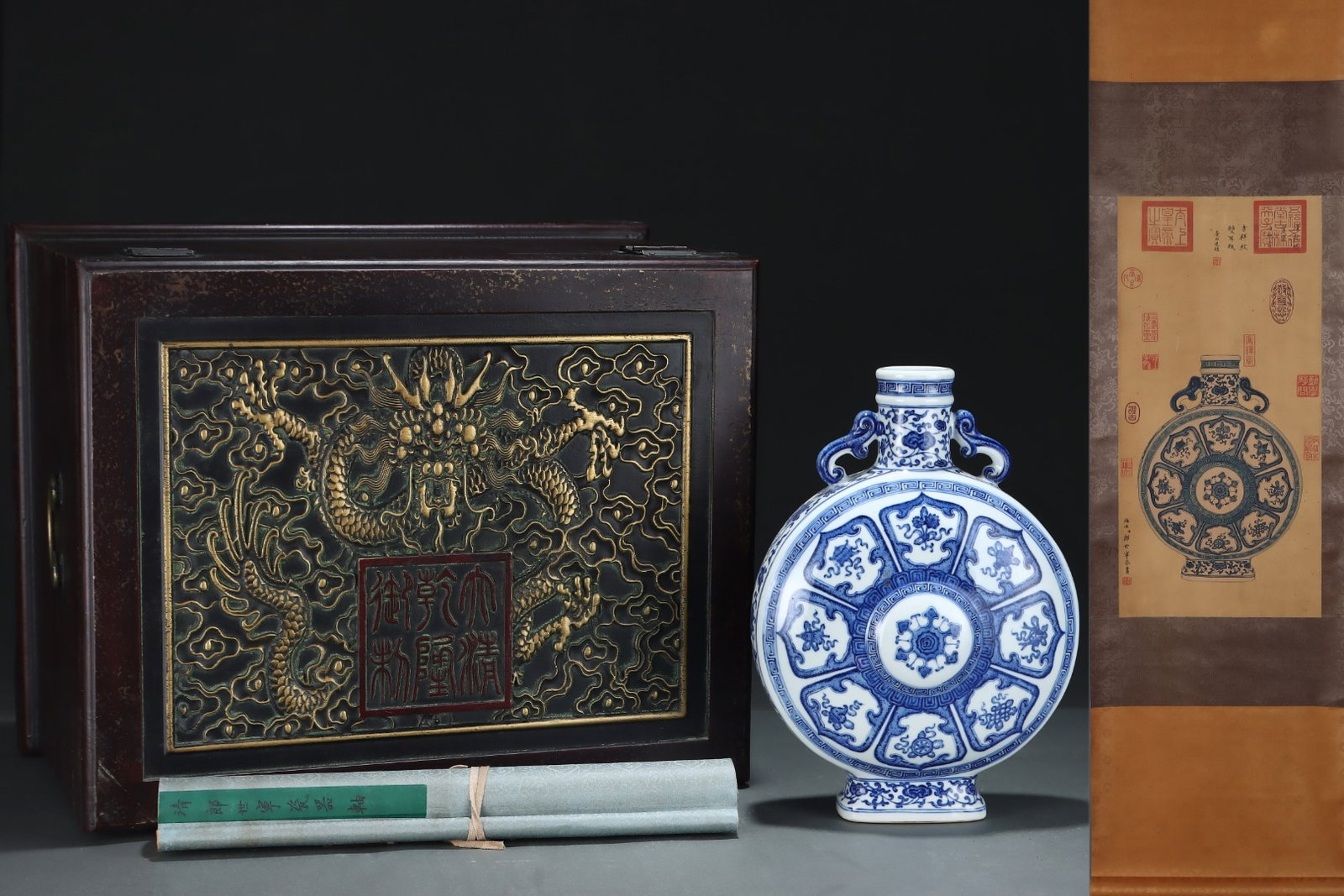 A Rare Blue and White Lotus and Eight Treasures Pattern Double-Ears Vase,With Vertical Scroll: A Rare Blue and White Lotus and Eight Treasures Pattern Double-Ears Vase,With Vertical Scroll Painting on Silk,Qing Dynasty, China,Qianlong Six-character Mark,Size:12.7inx9.3in,(Without frame)25.2inx1