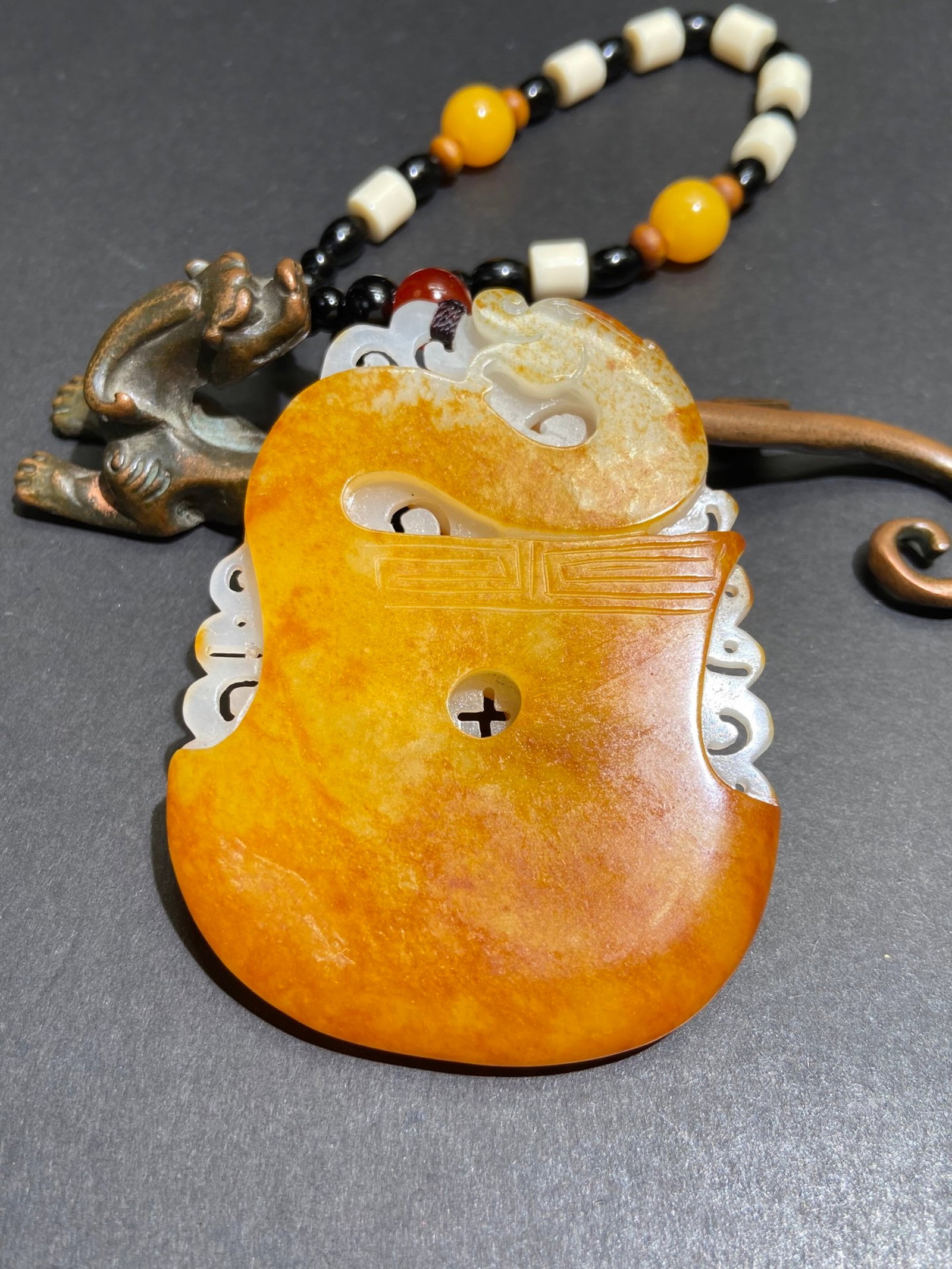 An Exquisite White Jade Dragon Pattern Pendant: An Exquisite White Jade Dragon Pattern Pendant,Qing Dynasty,China,Size:85.6mmx64.3mmx11mm,Weight:133g 白玉龙纹挂件,中国清代