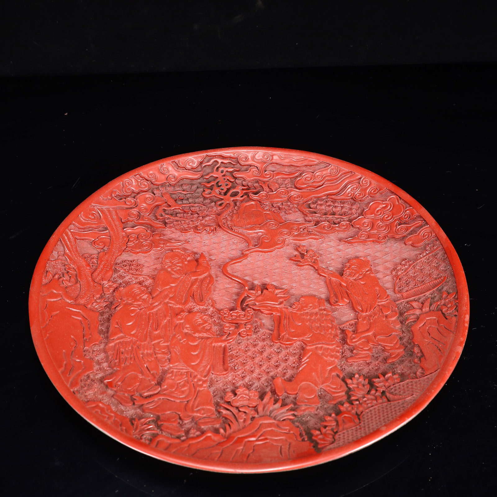 A Rare Carved Red Lacquer Figure Pattern Plate: A Rare Carved Red Lacquer Figure Pattern Plate,Qing Dynasty, China,Qianlong Six-character Mark,Size:14.6inx1.2in,Weight:950g