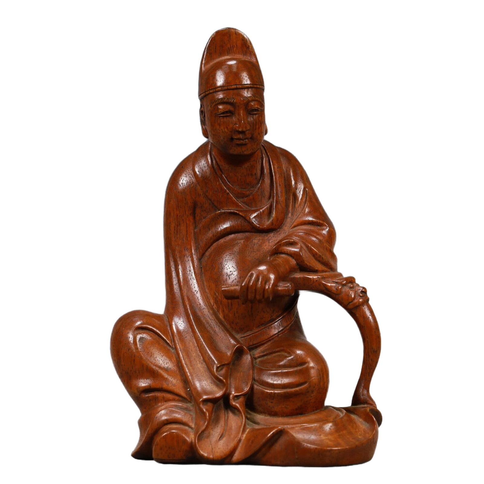 A Huanghuali Wood Figure: A Huanghuali Wood Figure. The figure is seated,body rendered clad in a robe,the voluminous drapery elegantly cascading in folds. Chinese Qing Dynasty. Size:4.3inx3.3inx7.7in 清代 黄&
