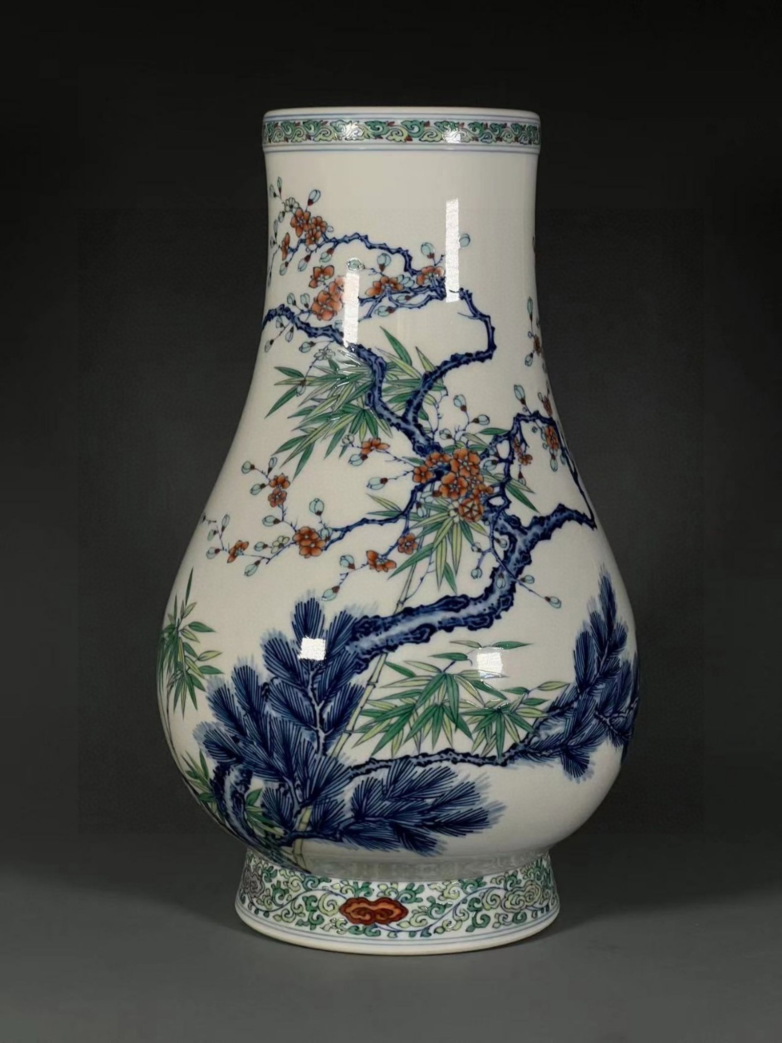 An Exquisite Blue and White Doucai Pine,Bamboo and Plum Blossom Pattern Vase: An Exquisite Blue and White Doucai Pine,Bamboo and Plum Blossom Pattern Vase,Qing Dynasty,China,Yongzheng Six-character Mark,Size:13.1inx4.3inx5.3in 青花斗彩松竹