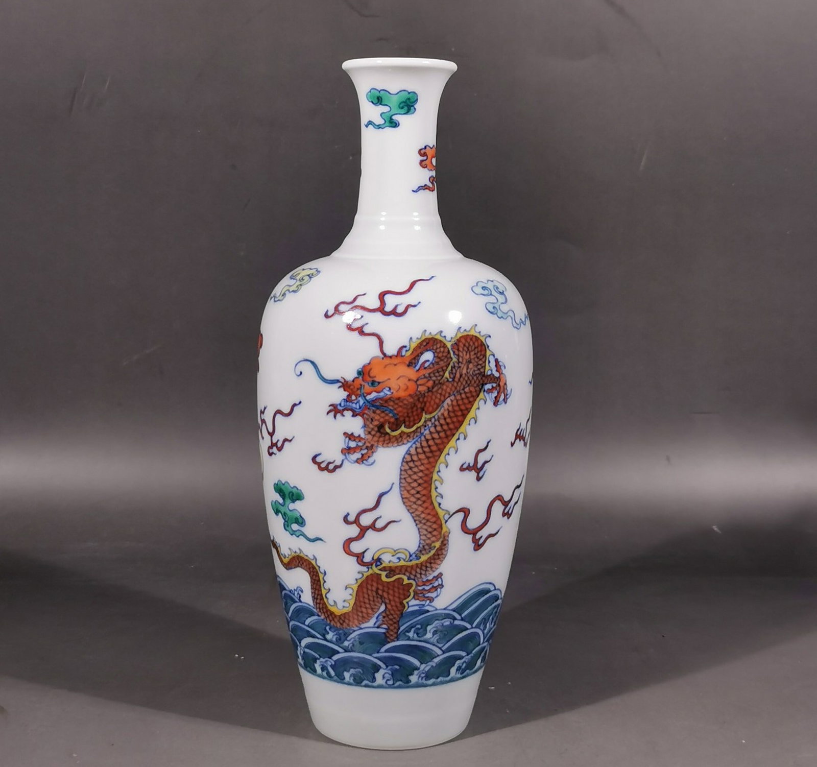 An Exquisite Blue and White Doucai Seawater,Auspicious Cloud and Dragon Pattern Vase: An Exquisite Blue and White Doucai Seawater,Auspicious Cloud and Dragon Pattern Vase,Qing Dynasty, China,Kangxi Six-character Mark,Size:9.4inx3.9in 青花斗彩海水
