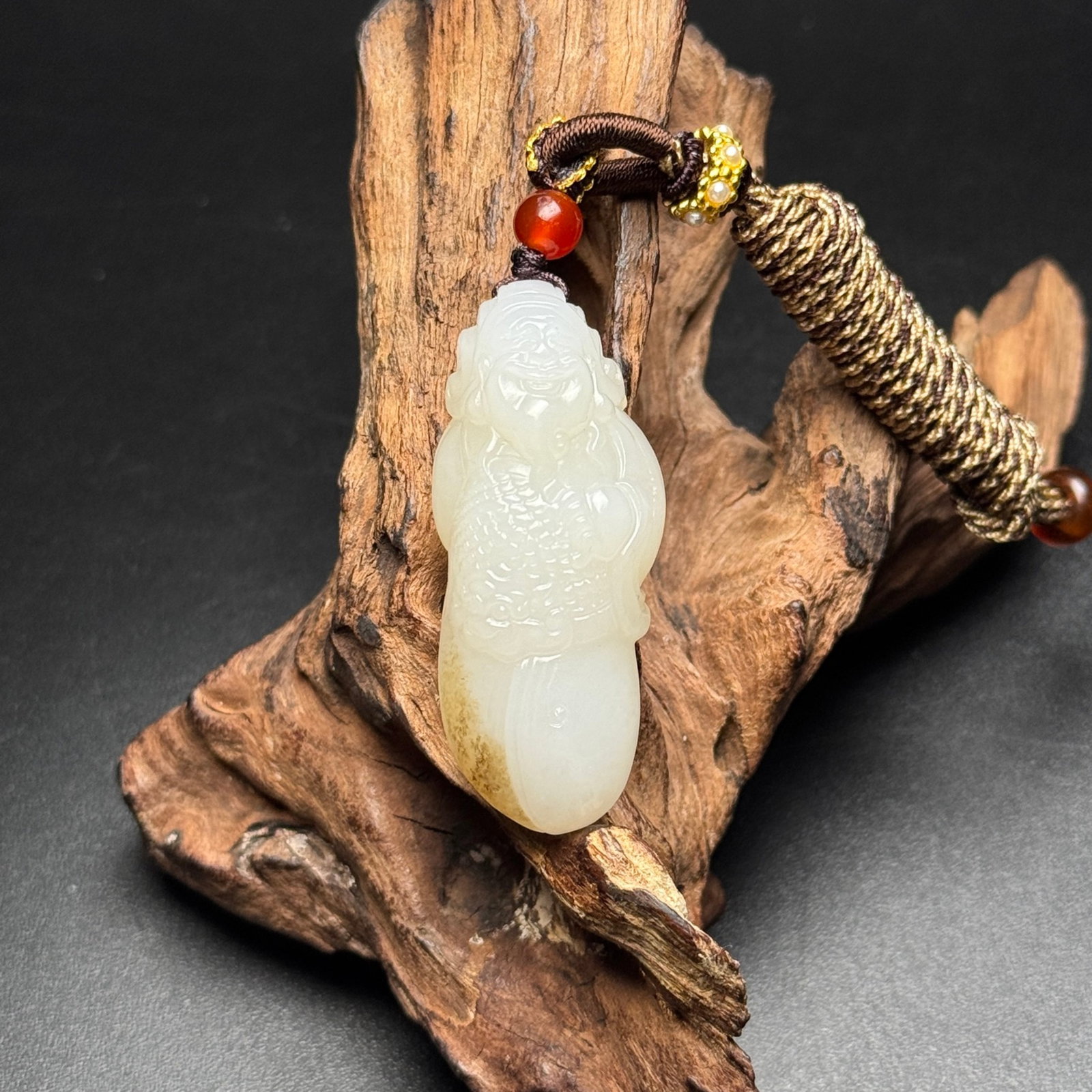 An Exquisite White Jade Statue of Mammon Pendant: An Exquisite White Jade Statue of Mammon Pendant,Qing Dynasty,China,Size:48mmx20mmx15mm,Weight:24g 白玉财神像挂件,中国清代