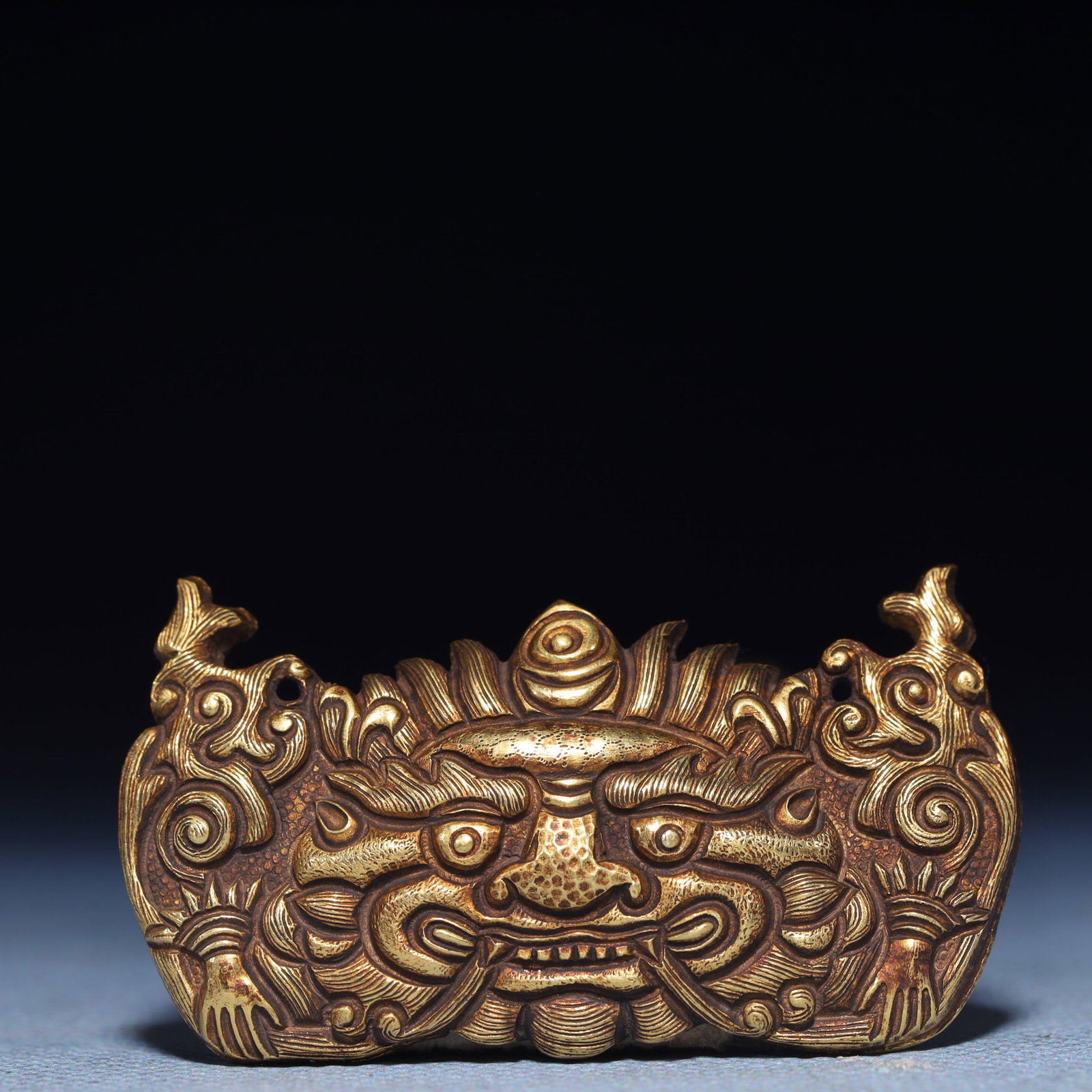 An Exquisite Gilt Silver Beast-Face Pattern Ornament: An Exquisite Gilt Silver Beast-Face Pattern Ornament,Qing Dynasty,China,Size:2.2inx1.2in,Weight:15g 银鎏金兽面纹摆件,中国清代