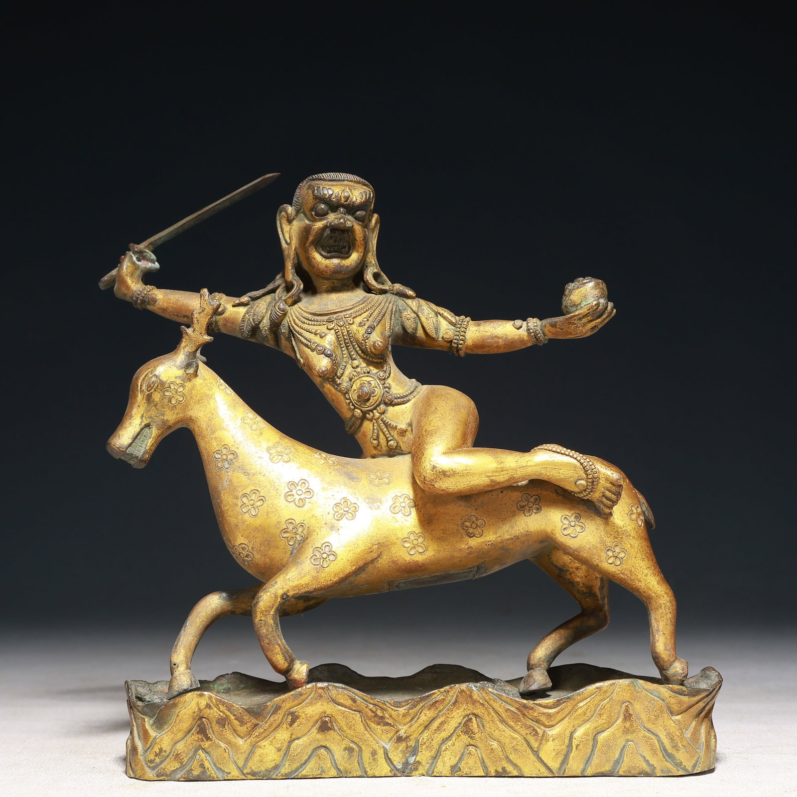 A Solemn Gilt Bronze Buddha Statue Rides the Sika Deer: A Solemn Gilt Bronze Buddha Statue Rides the Sika Deer,Qing Dynasty,China,Size:7.1inx2inx7.5in,Weight:2100g 铜鎏金骑鹿佛像,中国清代