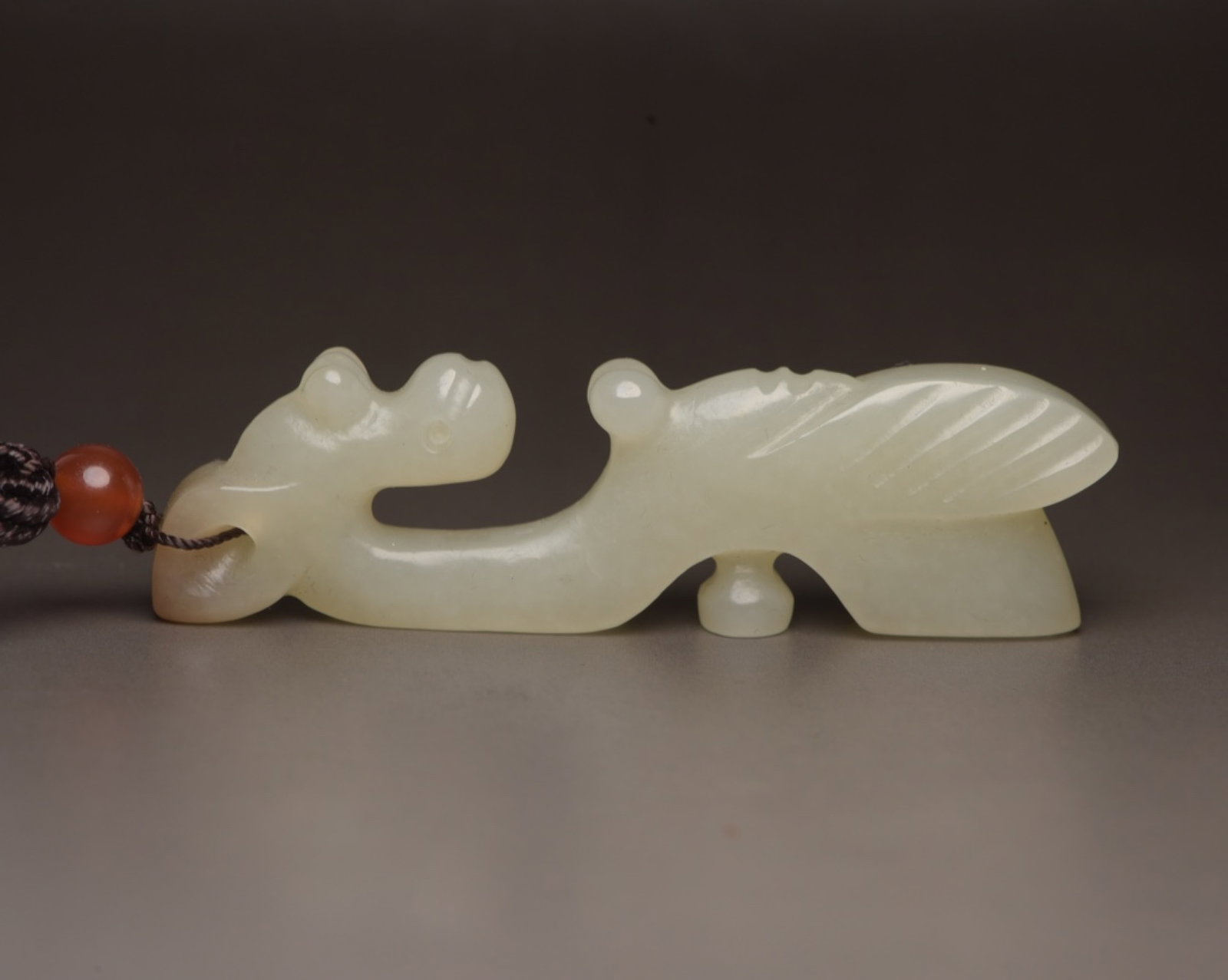 An Exquisite White Jade Pig and Dragon Ornament: An Exquisite White Jade Pig and Dragon Ornament,Qing Dynasty,China,Size:3inx0.8inx0.4in,Weight:31g 白玉猪龙摆件,中国清代