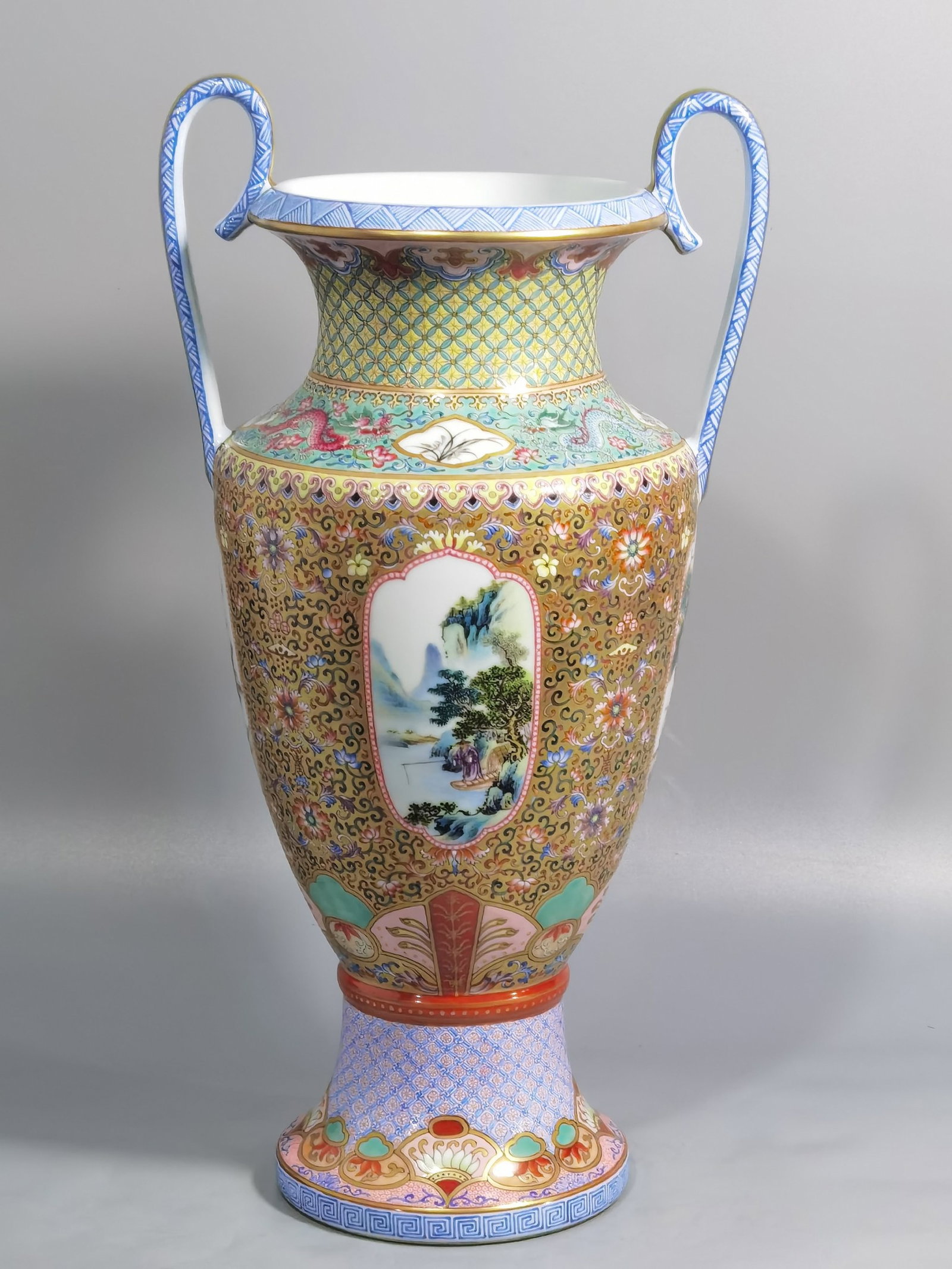 A Rare Famille-Rose Gold Ground Landscape Pattern Double-Ears Vase: A Rare Famille-Rose Gold Ground Landscape Pattern Double-Ears Vase,the Republic of China,With Mark,Size:14.4inx6.1in 粉彩金地山水纹双耳瓶,&#