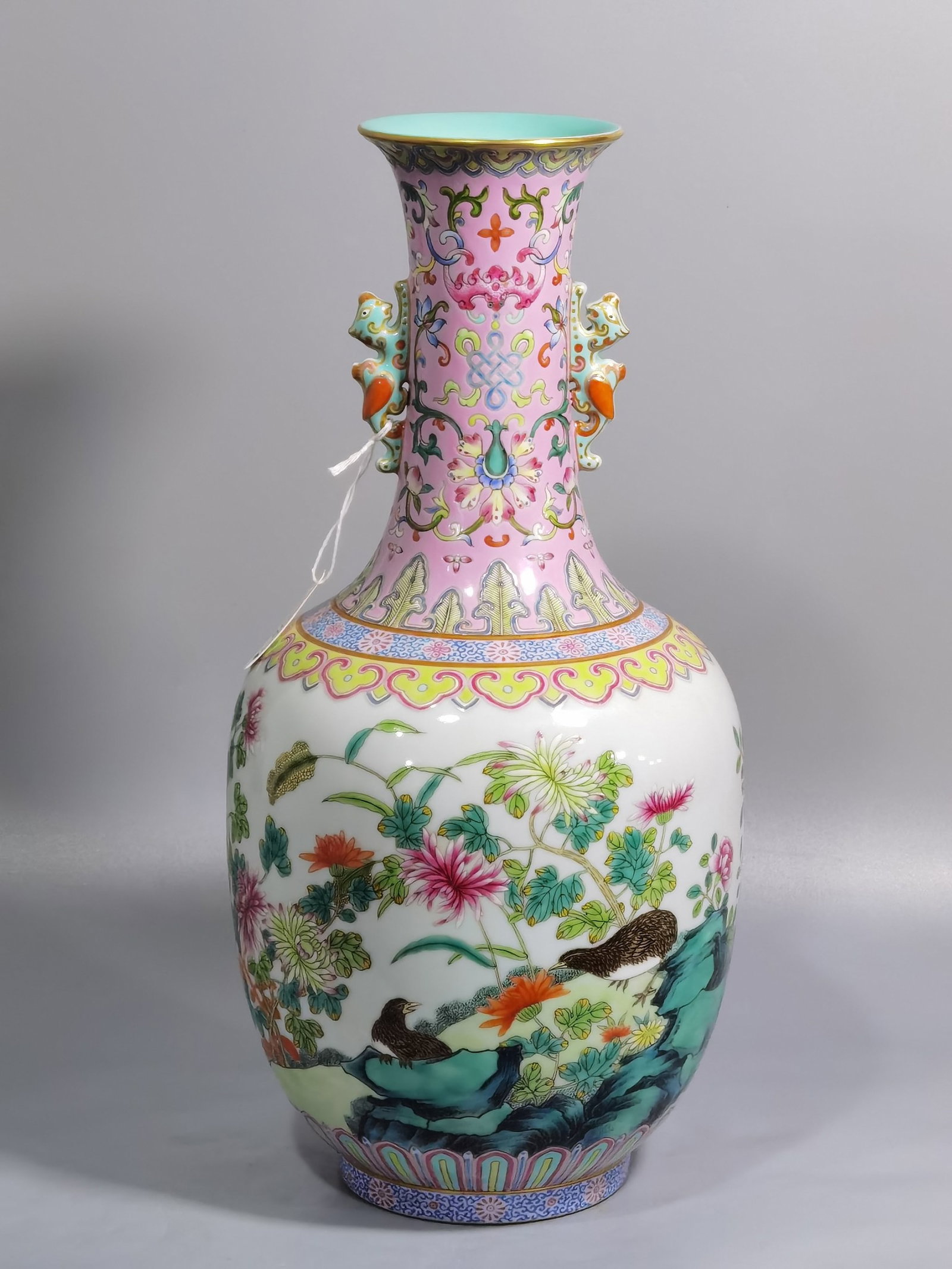 A Rare Famille-Rose Flower and Bird Pattern Beast-Ears Vase: A Rare Famille-Rose Flower and Bird Pattern Beast-Ears Vase,Qing Dynasty,China,Qianlong Six-character Mark,Size:13.6inx6.7in