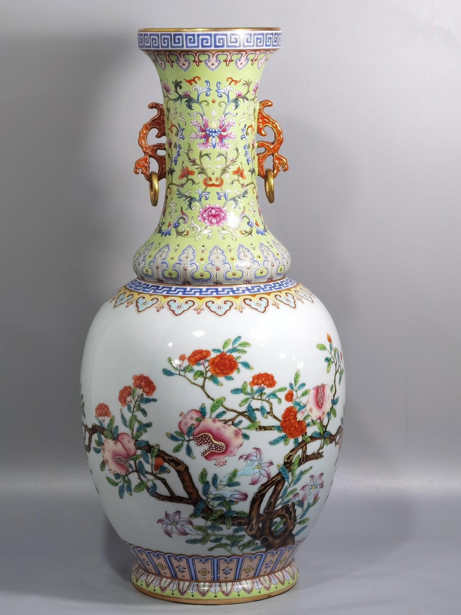 A Huge Green Ground Famille-Rose Flower and Fruit Pattern Double-Ears Vase: A Huge Green Ground Famille-Rose Flower and Fruit Pattern Double-Ears Vase,Qing Dynasty,China,Qianlong Six-character Mark,Size:21.9inx10.4in 绿地粉彩花果纹