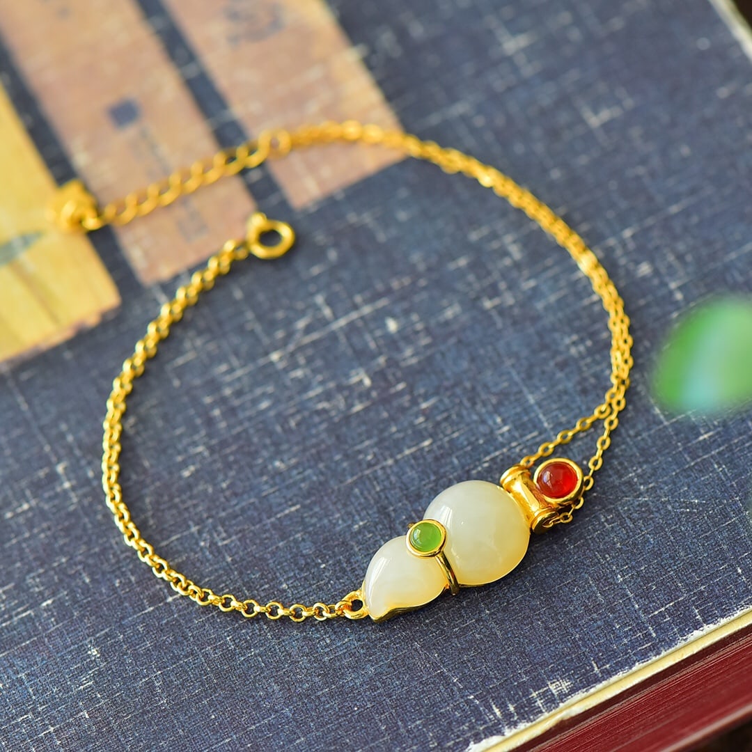 An Exquisite Sterling Silver-Gold Plated Inlaid White Jade Bracelet: An Exquisite Sterling Silver-Gold Plated Inlaid White Jade Bracelet,Size:0.5inx0.8in 纯银镀金镶白玉手链