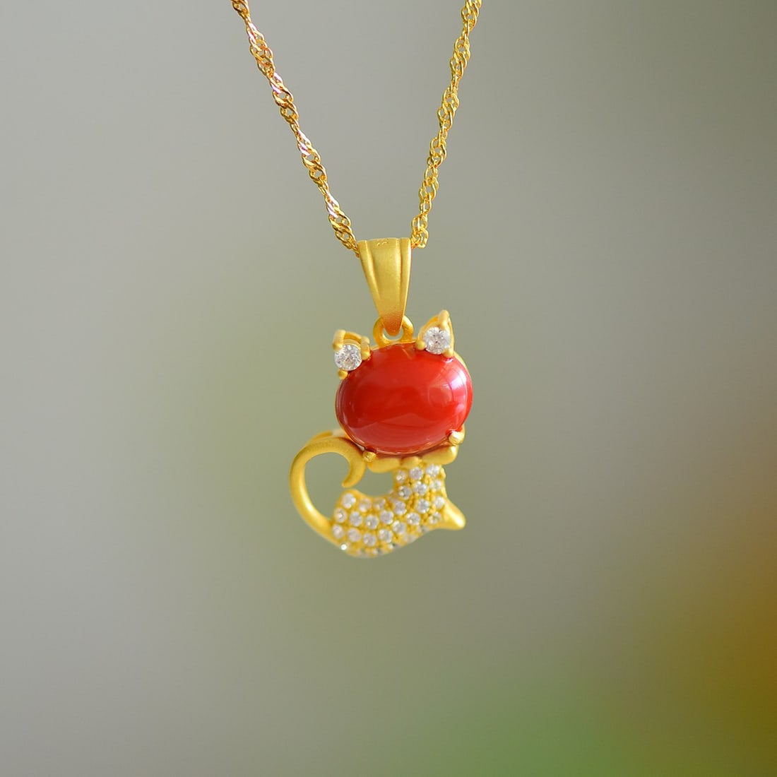 An Exquisite Sterling Silver-Gold Plated Inlaid Cinnabar Pendant,Inlaid Diamond: An Exquisite Sterling Silver-Gold Plated Inlaid Cinnabar Pendant,Inlaid Diamond,Size:0.3inx0.4in 寓意:招财纳福,守护平安