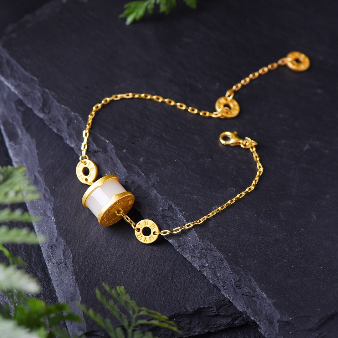 An Exquisite Sterling Silver-Gold Plated Inlaid White Jade Bracelet: An Exquisite Sterling Silver-Gold Plated Inlaid White Jade Bracelet,Size:0.3inx0.5in 纯银镀金镶白玉手链