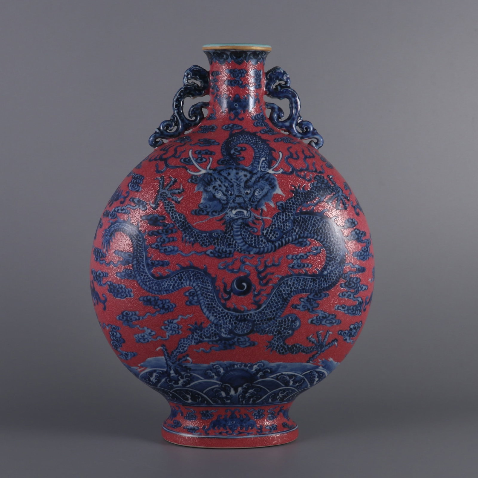 An Exquisite Blue and White Ruby Red-Glazed Dragon Pattern Seawater Pattern Double-Ears Vase: An Exquisite Blue and White Ruby Red-Glazed Dragon Pattern Seawater Pattern Double-Ears Vase Qing Dynasty, China Qianlong Six-character Mark