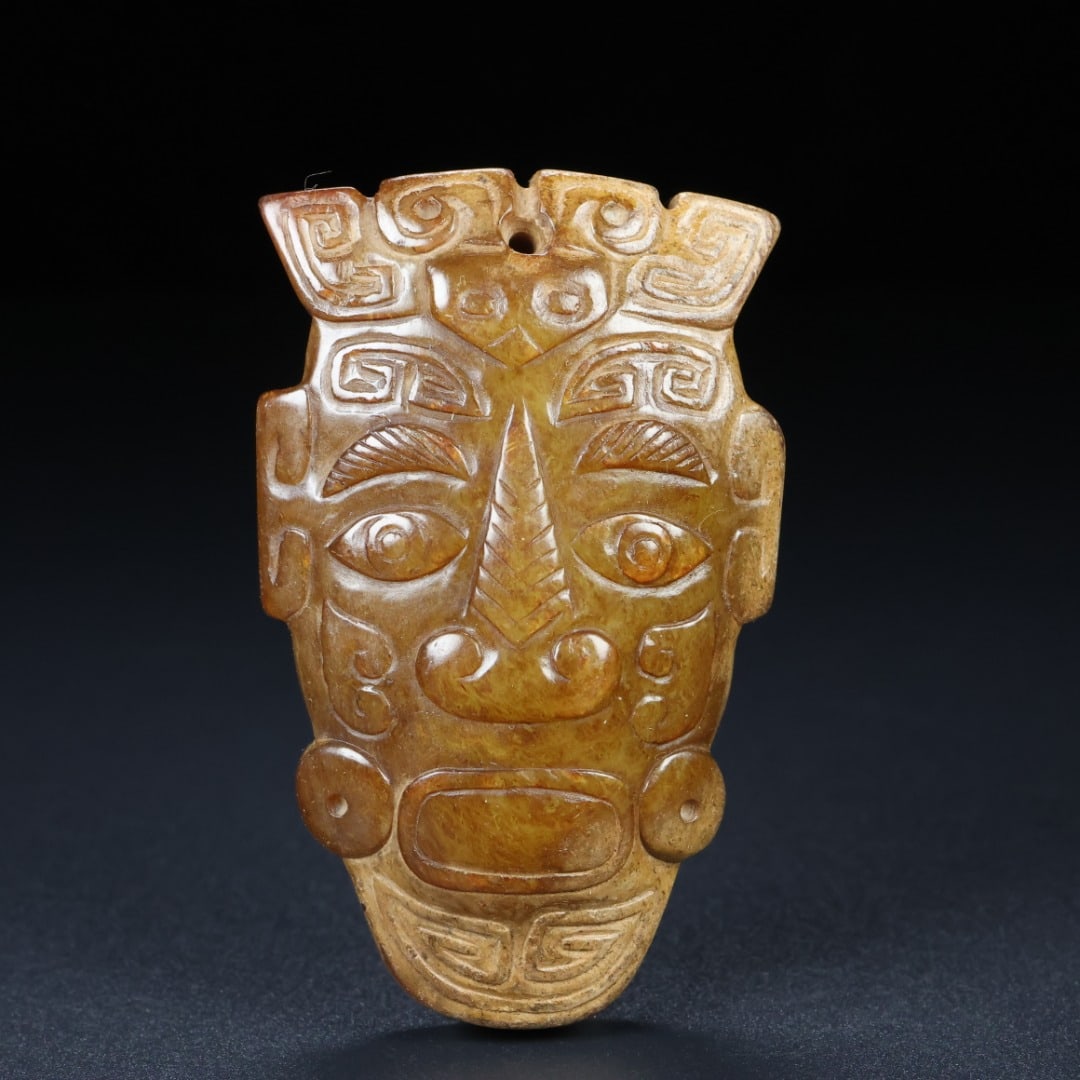 An Exquisite White Jade Human Face Pattern Ornament: An Exquisite White Jade Human Face Pattern Ornament Han Dynasty, China Size:2.6inx1.7inx0.5in Weight:77g白玉玉人面 中国汉代 Size:6.7cmx4.4cmx1.3cm