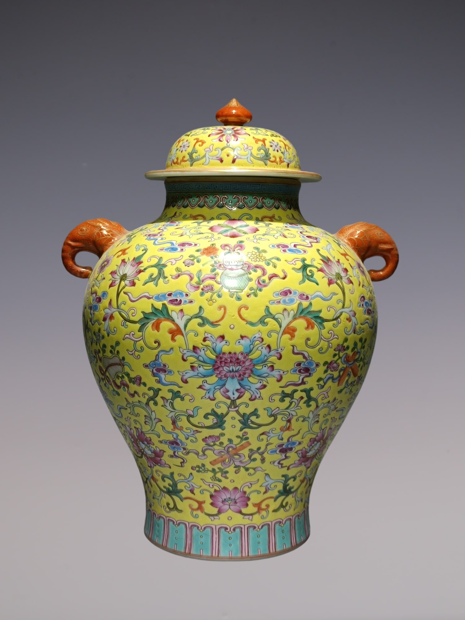 An Exquisite Famille-Rose Eight Treasures Pattern Lotus Pattern Double-Ears Jar: An Exquisite Famille-Rose Eight Treasures Pattern Lotus Pattern Double-Ears Jar Qing Dynasty, China Qianlong Six-character Mark Size:13.4inx10.2in粉彩黄地莲托ࠤ