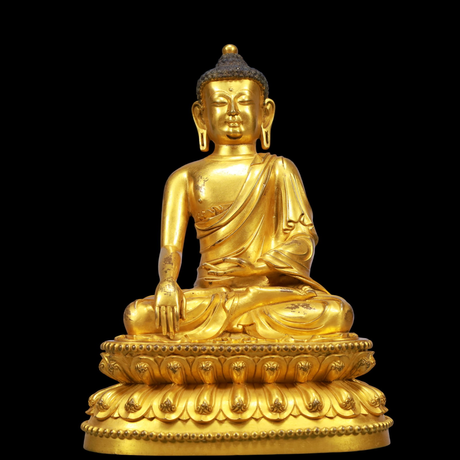 An Exquisite Gilt Bronze Statue of Sakyamuni: An Exquisite Gilt Bronze Statue of Sakyamuni Ming Dynasty, China Yongle Six-character Mark Size:7.1inx4.7inx9.8in Weight:3350g铜鎏金如来佛像 中国&