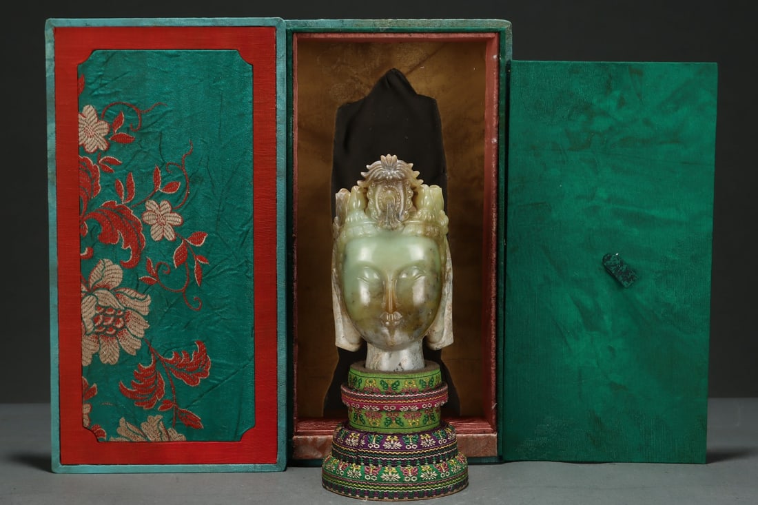 An Exquisite White Jade Buddha head: An Exquisite White Jade Buddha head Qing Dynasty, China Size:5.9inx3.1in白玉佛头 中国清代 Size:15cmx8cm