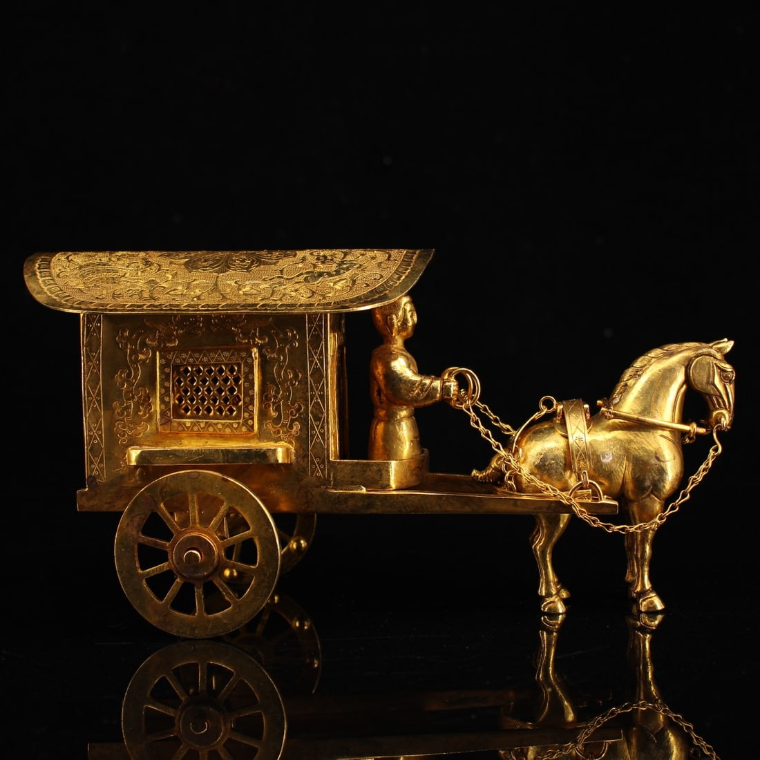 An Exquisite Gilt Bronze Carriage Ornament: An Exquisite Gilt Bronze Carriage Ornament Qing Dynasty, China Size:11inx4.5inx5.1in Weight:1250g铜鎏金马拉车一套 中国清代