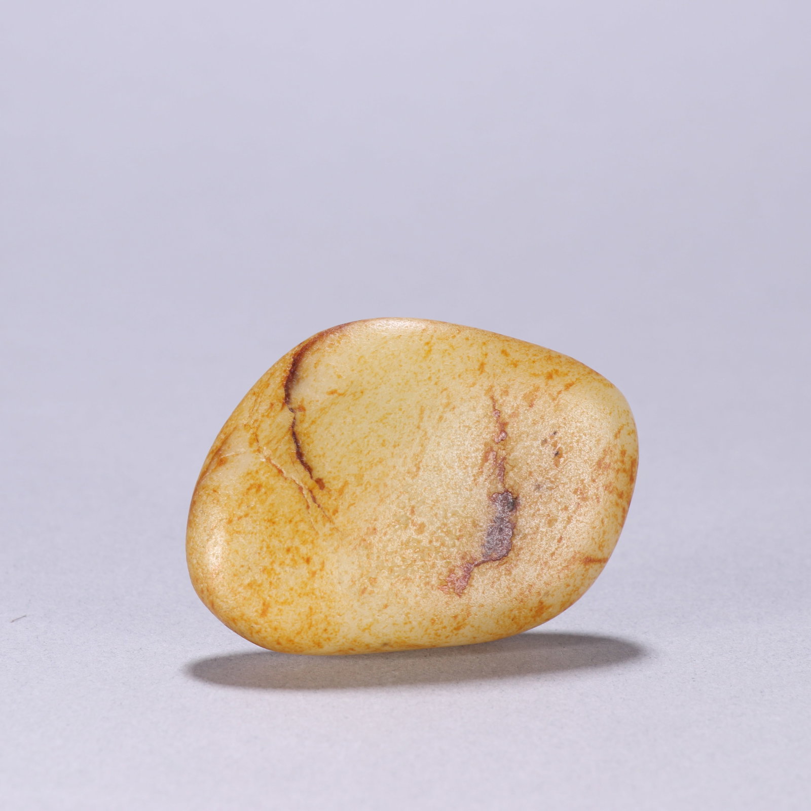 An Exquisite White Jade Ornament: An Exquisite White Jade Ornament Qing Dynasty, China Size:2.4inx1.7in Weight:72.2g白玉原石摆件 中国清代 Size:6cmx4.2cm Weight:72.2g