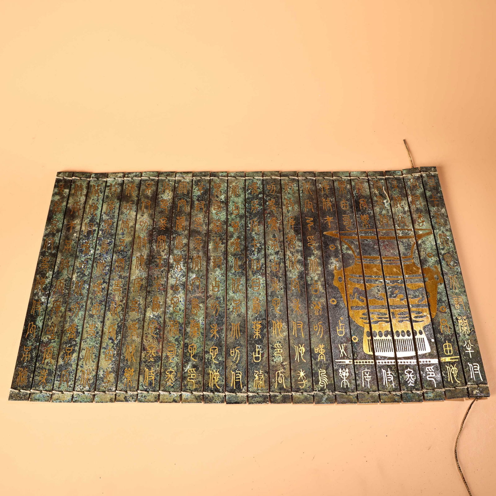 An Exquisite Bronze With Inscription Ornament: An Exquisite Bronze With Inscription Ornament Han Dynasty, China Size:19.7inx11in Weight:1600g青铜器竹简书 中国汉代 Size:50cmx28cm Weight:16