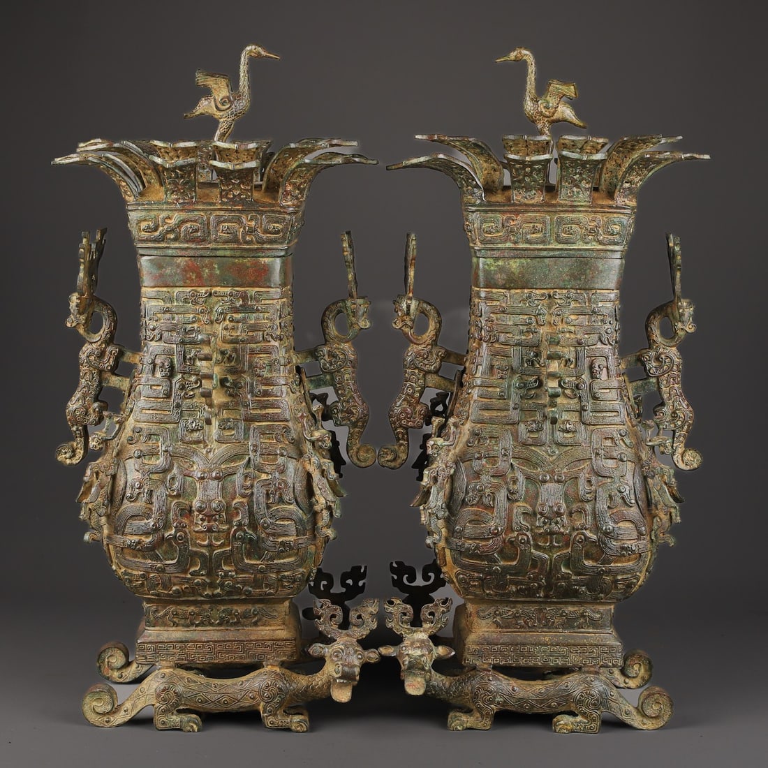 A Pair of Exquisite Bronze Auspicious Beast Pattern Double-Ears Vase: A Pair of Exquisite Bronze Auspicious Beast Pattern Double-Ears Vase W.Zhou , China Size:11inx22.8in Weight:19050g青铜连鹤方瓶一对 西周ą