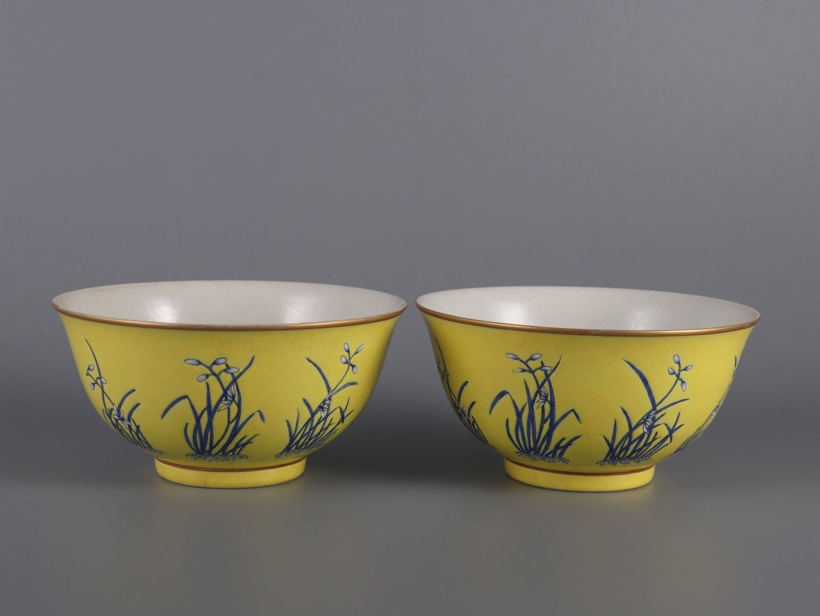 A Pair of Exquisite Yellow Ground Famille-Rose Orchid Pattern Bowls: A Pair of Exquisite Yellow Ground Famille-Rose Orchid Pattern Bowls,Qing Dynasty,China,Tongzhi Four-character Mark,Size:2.8inx5.6in 一对黄地粉彩兰花 