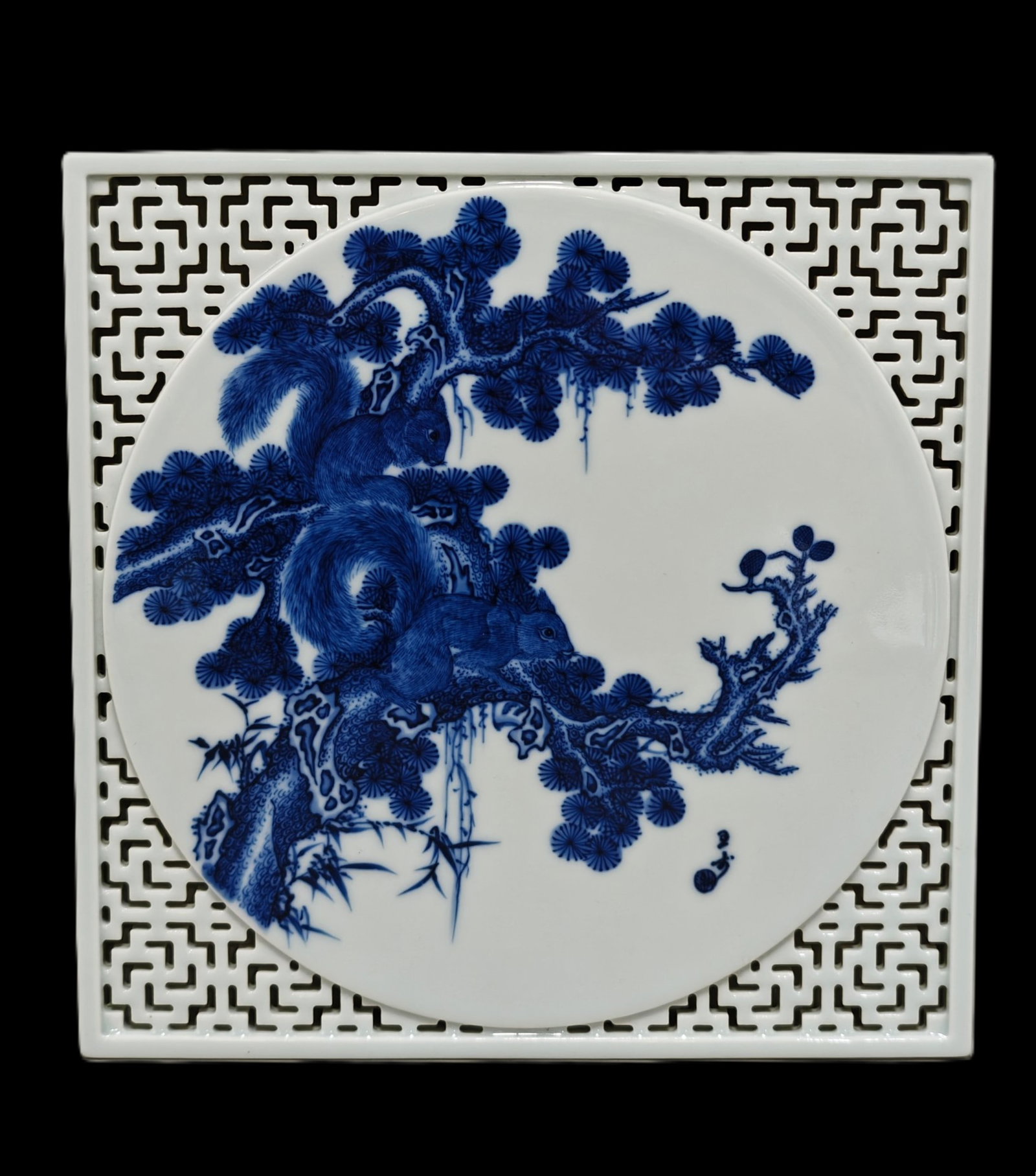 An Exquisite Blue and White Hollow Pine Pattern Base: An Exquisite Blue and White Hollow Pine Pattern Base,Qing Dynasty,China,Size:8.5inx0.8in 青花镂空松树纹底座中国清代