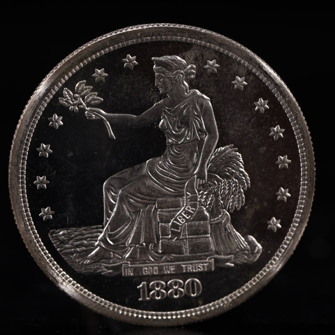 USA Trade Dollar 1880 Coin: American coin. Obverse: Liberty seated on a pedestal facing the sea to the left holding olive branches surrounded by 13 stars. IN GOD WE TRUST / LIBERTY / 1880. Reverse: An eagle holding branches