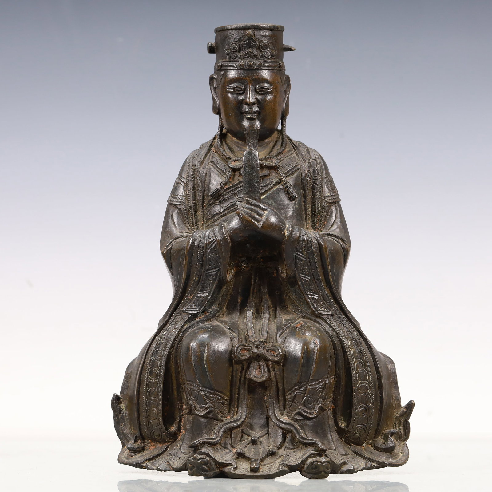 An Excellent Bronze Figure Of Wen Qu Xing: An Excellent Bronze Figure Of Wen Qu Xing. Seated with a benevolent expression,body rendered clad in long,flowing robes,the voluminous drapery elegantly cascading in folds. Chinese Ming Dynasty.