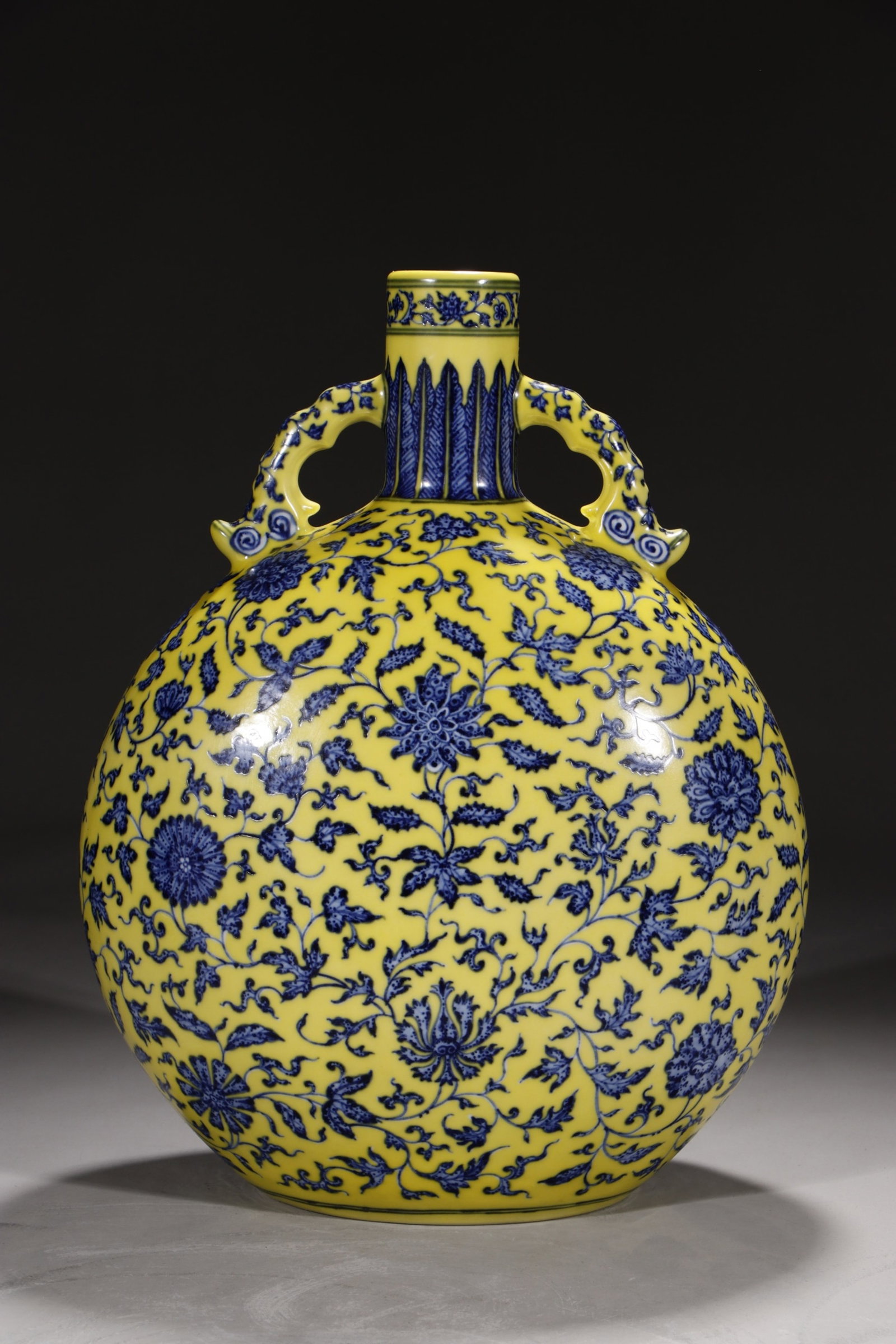 A Rare Yellow Ground Blue and White Lotus Pattern Double-Ears Vase: A Rare Yellow Ground Blue and White Lotus Pattern Double-Ears Vase,Qing Dynasty,China,Yongzheng Six-character Mark,Size:14.8in 黄地青花缠枝莲纹双&