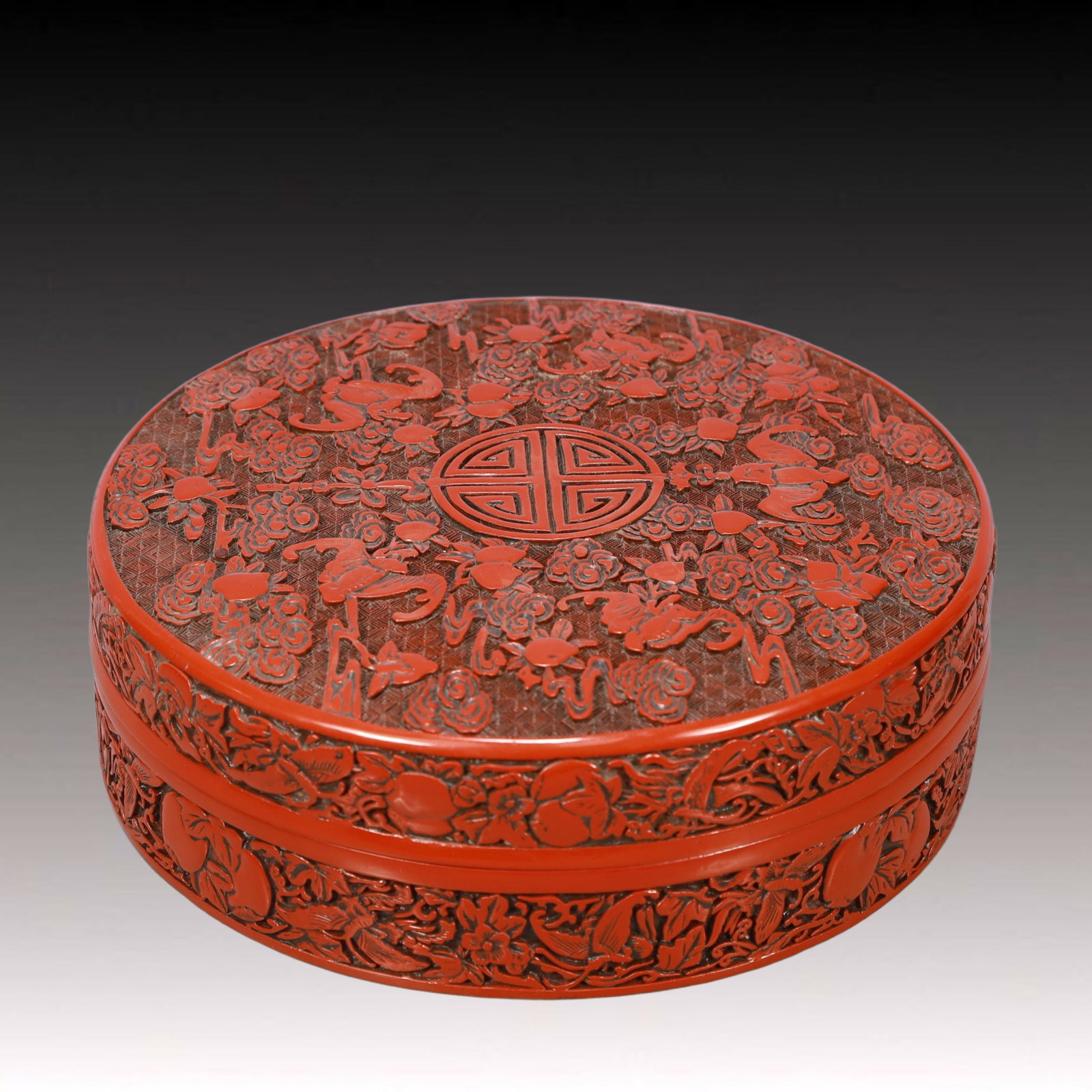 An Exquisite Carved Red Lacquer Bats and Peach Pattern Cover Box: An Exquisite Carved Red Lacquer Bats and Peach Pattern Cover Box,Qing Dynasty, China,Qianlong Six-character Mark,Size:10inx3.1in,Weight:1750g 剔红漆器福寿纹&#
