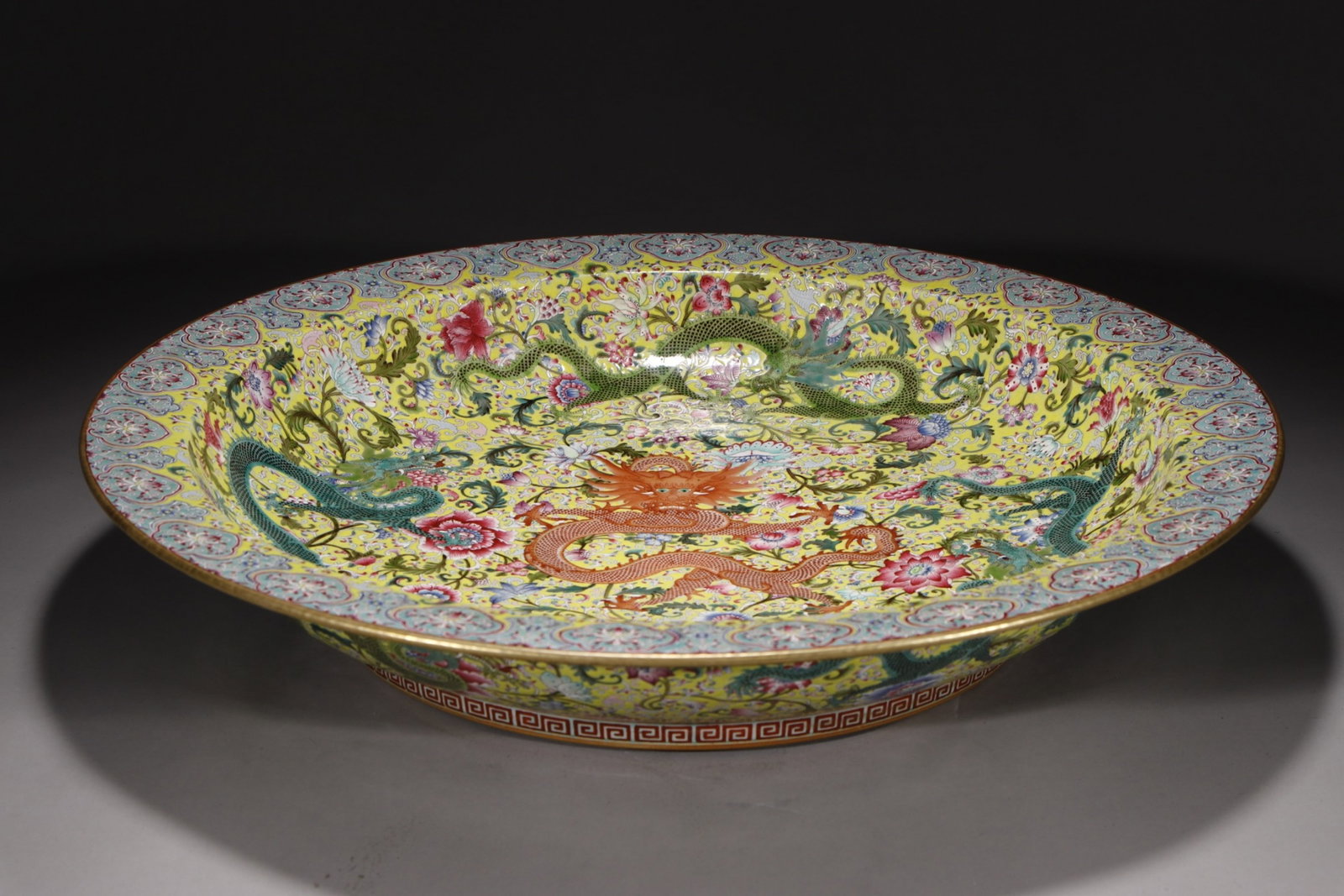 A Huge Yellow Ground Famille-Rose Flower and Dragon Pattern Plate: A Huge Yellow Ground Famille-Rose Flower and Dragon Pattern Plate,Qing Dynasty,China,Qianlong Six-character Mark,Size:3.8inx20.9in