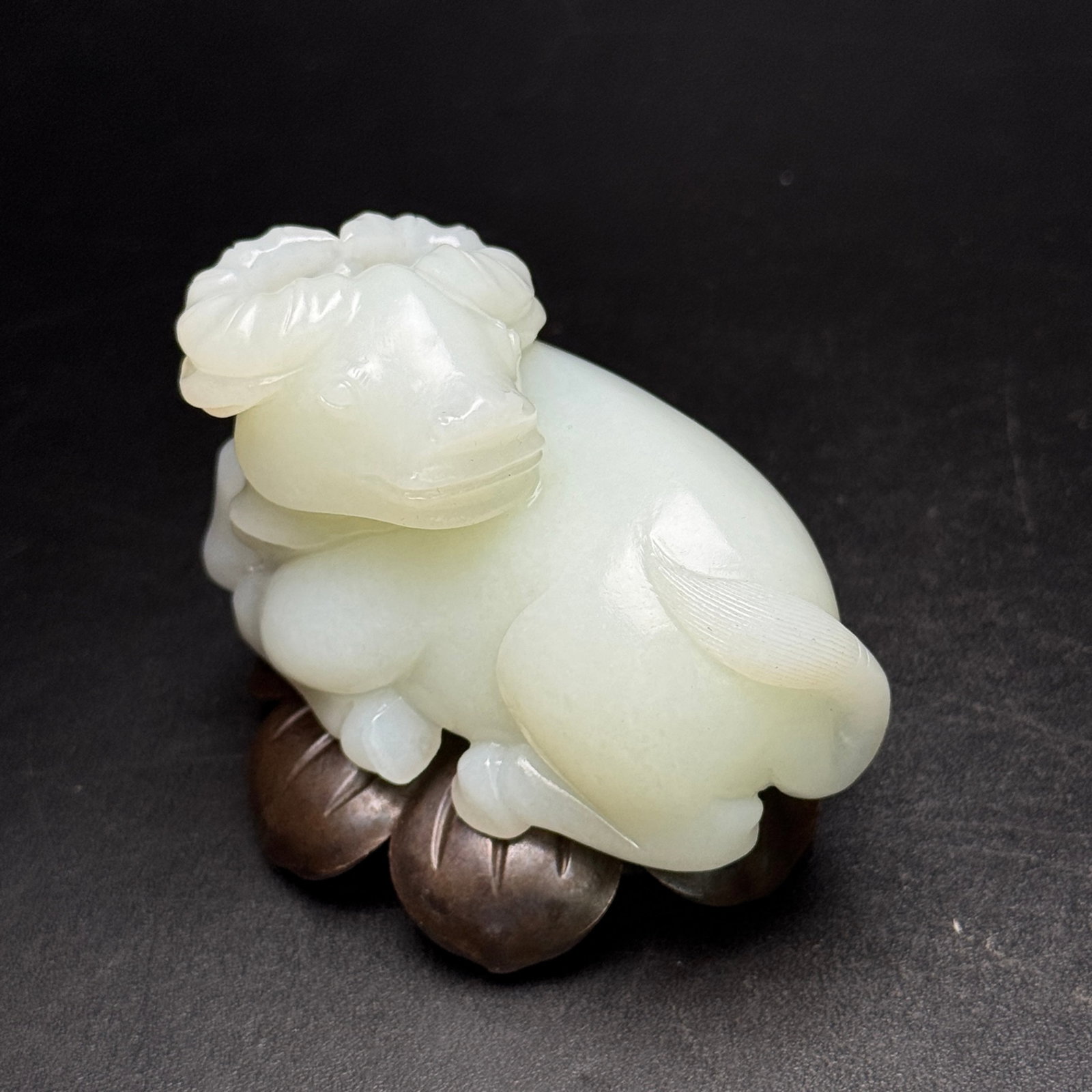 An Exquisite White Jade Buffalo Ornament: An Exquisite White Jade Buffalo Ornament,Qing Dynasty,China,Size:2.8inx1.8inx1.6in,Weight:160g 白玉牛摆件,中国清代