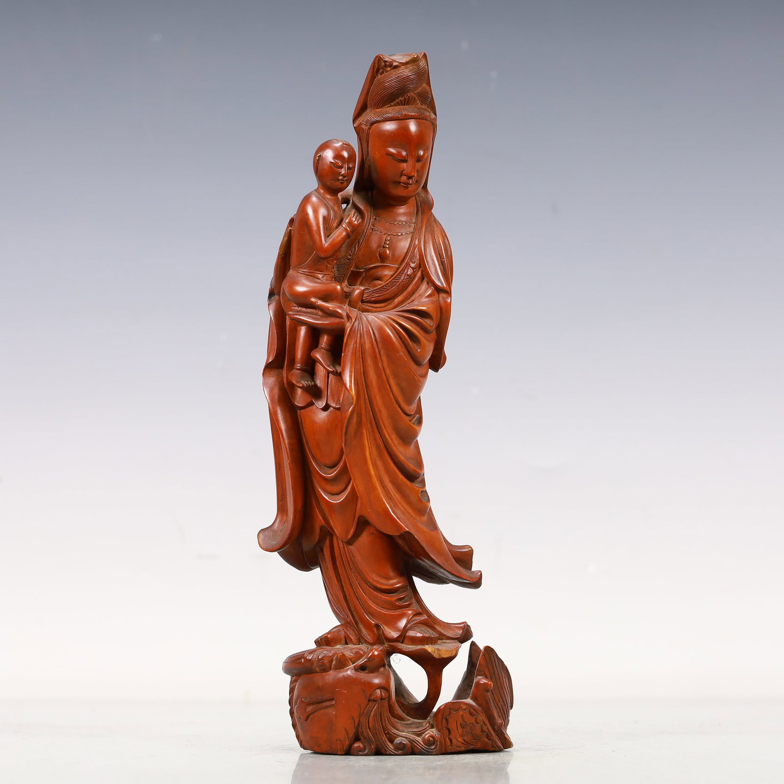 A Marvelous Boxwood 'Guanyin And Boy' Decoration: A Marvelous Boxwood 'Guanyin And Boy' Decoration. Stood on a base,body rendered clad in long,flowing robes,the voluminous drapery elegantly cascading in folds. Chinese Qing Dynasty.
